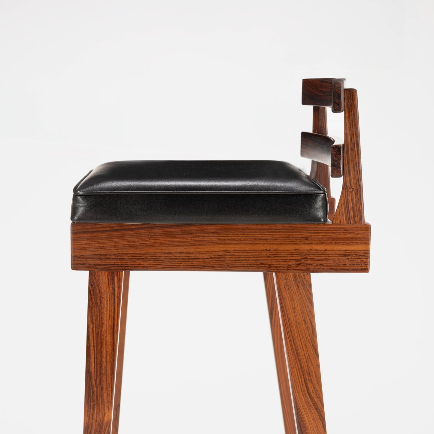 Erik Buck Pair of Rosewood Stools with a rich rosewood frame featuring angular backrest slats and a smooth black leather padded seat, reflecting mid century modern seating design.