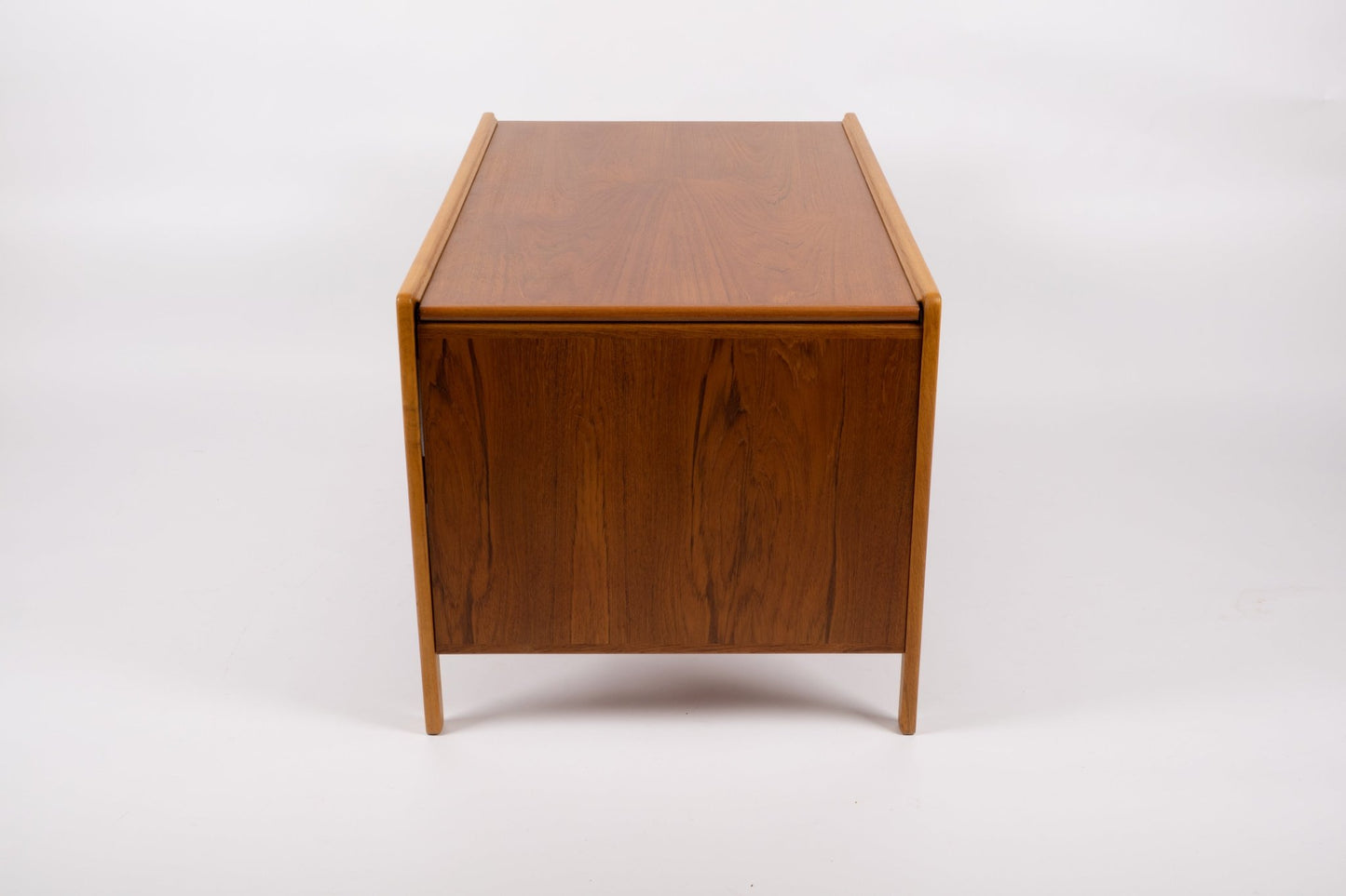 Expandable mid-century modern coffee table with teak wood top, tapered legs, and pivoting sliding tabletop mechanism.