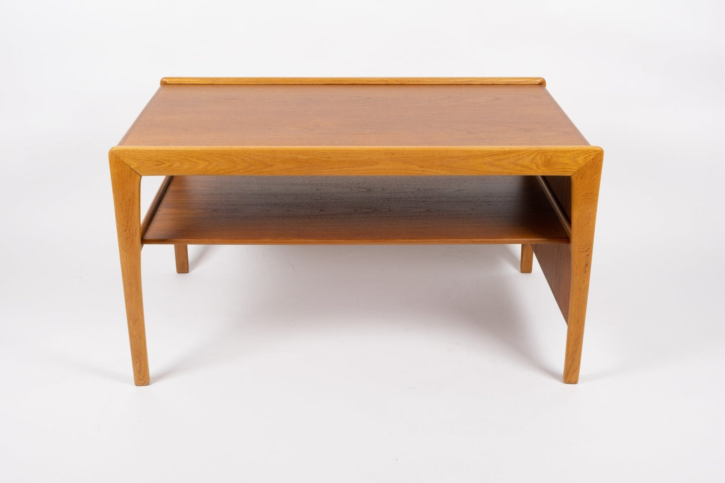 Expandable mid-century modern wooden coffee table with tapered legs and smooth sliding top in warm finish.