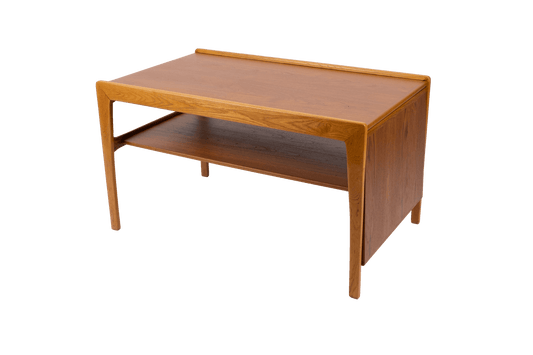 Expandable mid-century modern wooden coffee table with pivoting top, tapered legs, and lower shelf in warm finish