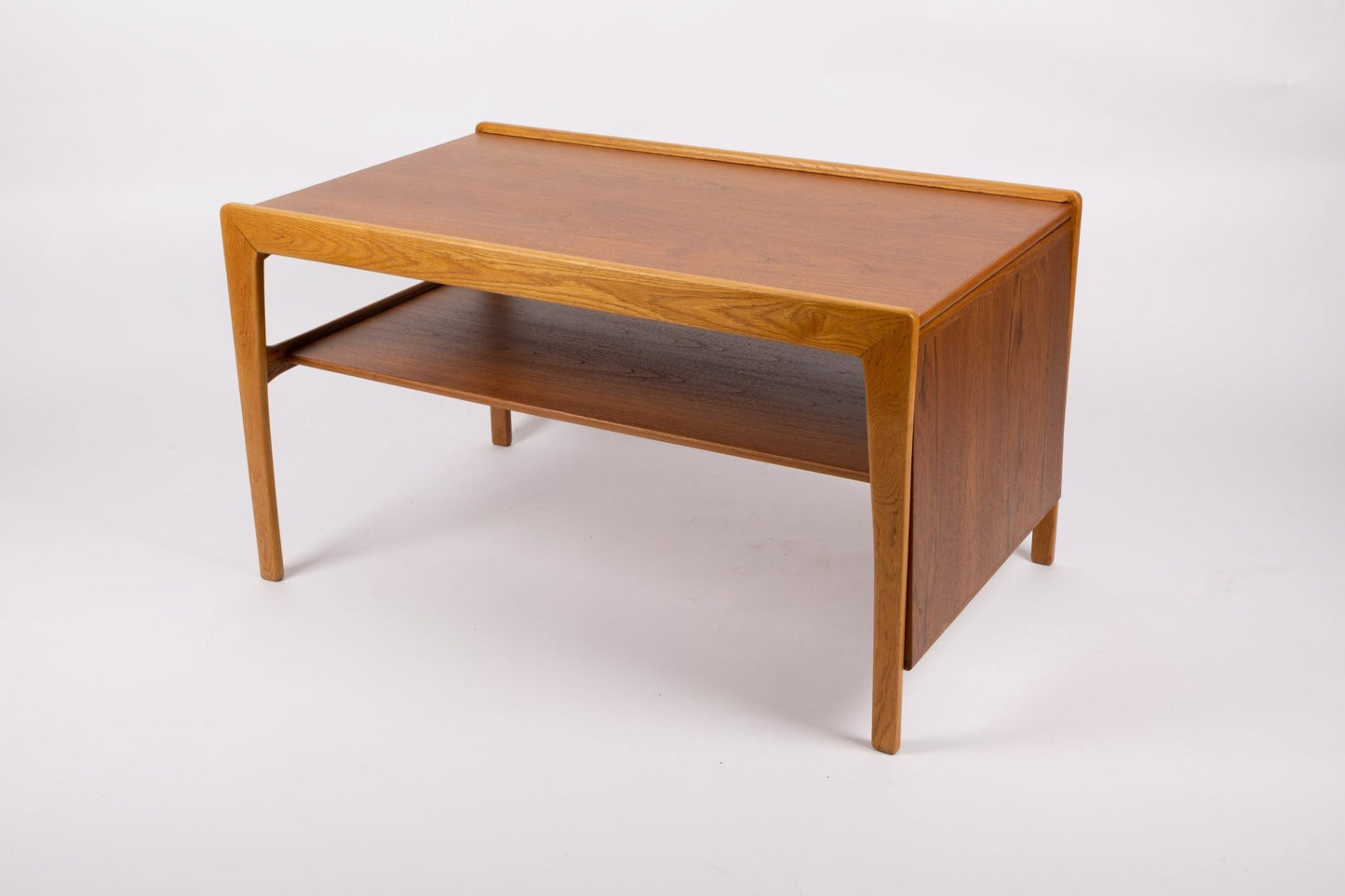 Mid-century modern expandable teak coffee table with tapered legs and smooth wooden finish on white background