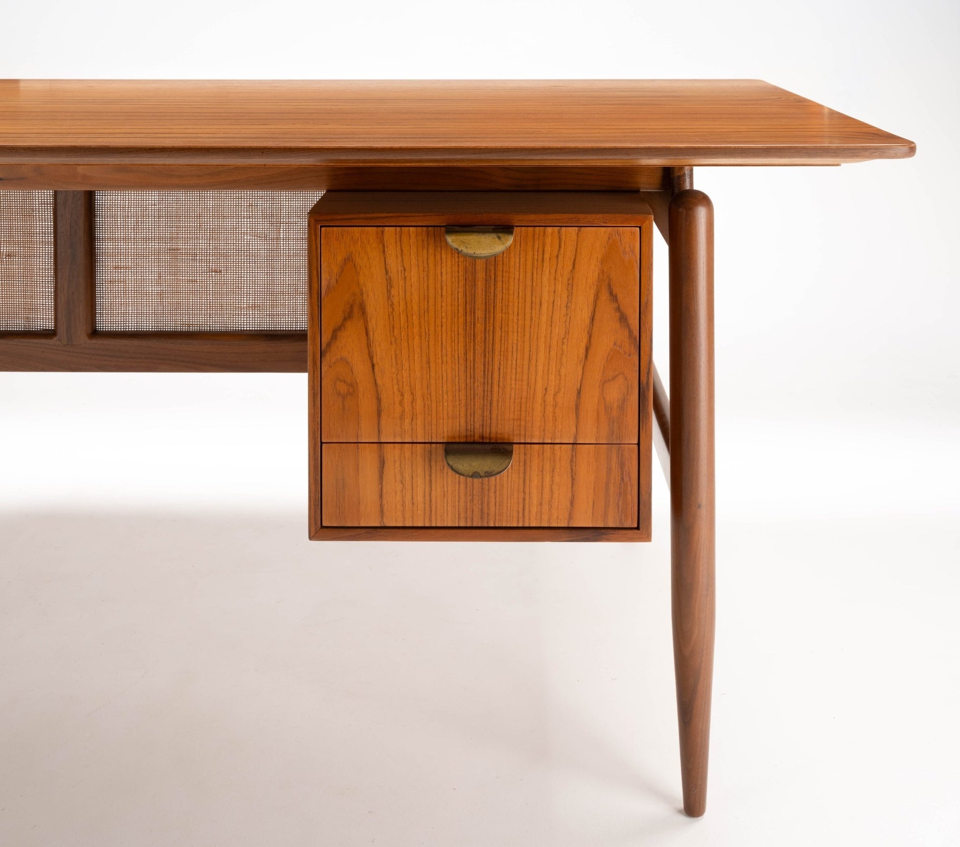Mid-century modern walnut executive desk with cane panel and two drawer cabinet by Finn Juhl, 1950s design.