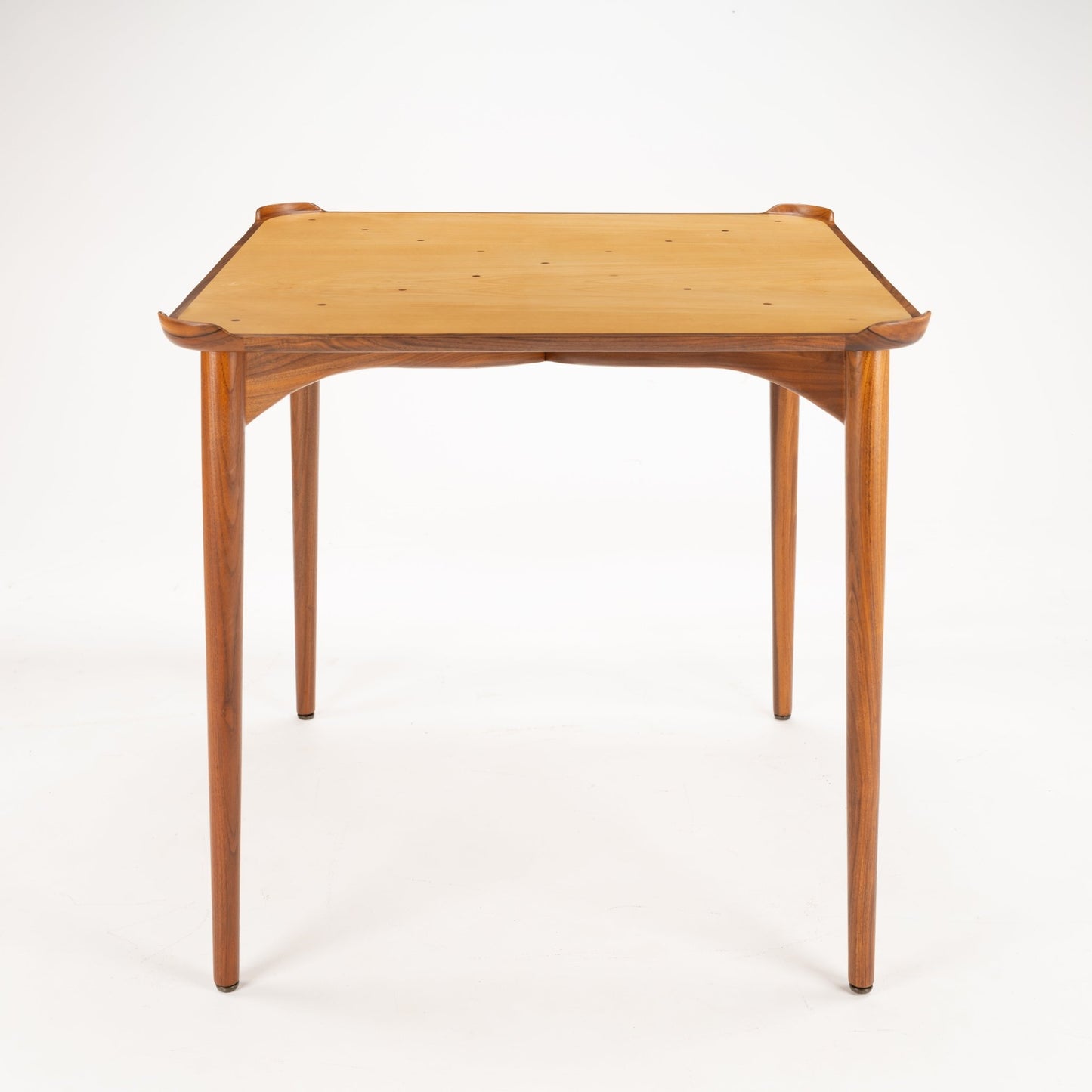 Finn Juhl Walnut Card Table for Baker showcasing a refined walnut frame with tapered legs and a smooth, light wood tabletop, reflecting classic mid century modern furniture design.