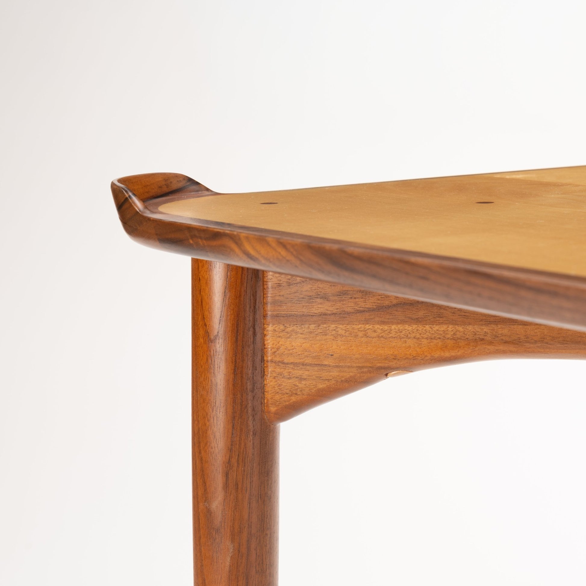 Finn Juhl Walnut Card Table for Baker displaying a sculpted walnut edge with smooth rounded corners and finely tapered legs, embodying elegant mid century modern craftsmanship.