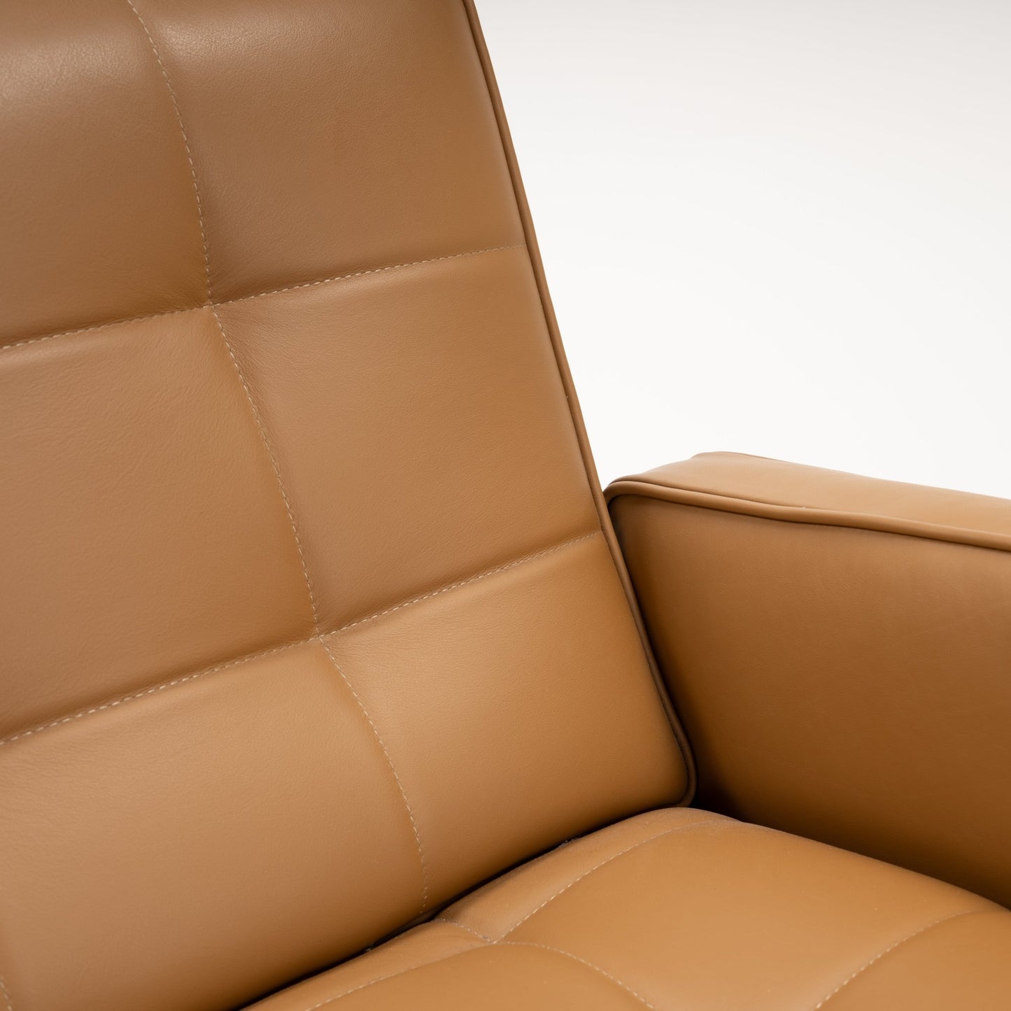 Florence Knoll 'Relaxed' Settee in Leather featuring caramel brown stitched cushions and a structured arm in mid century modern furniture style