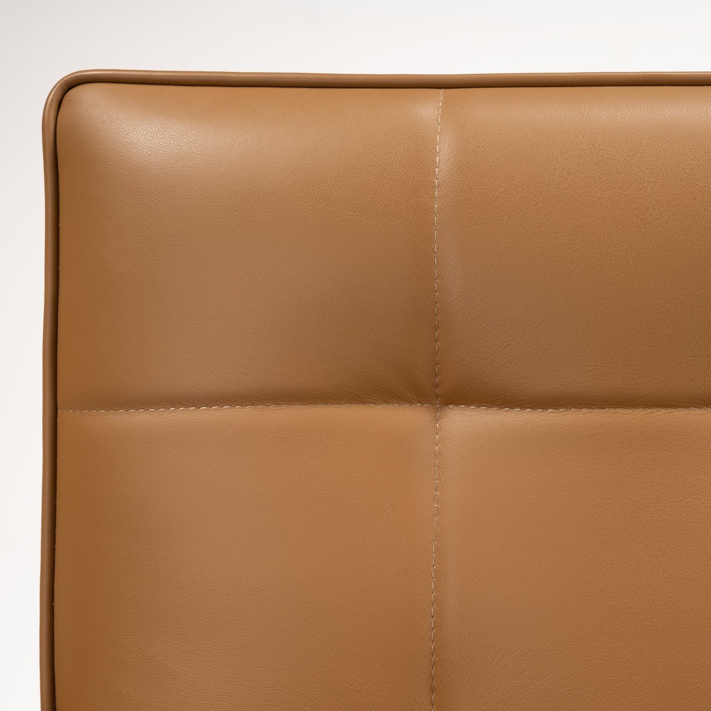 Florence Knoll 'Relaxed' Settee in Leather close up showing caramel brown upholstery with cross stitched seams and smooth padded panels in mid century modern furniture style