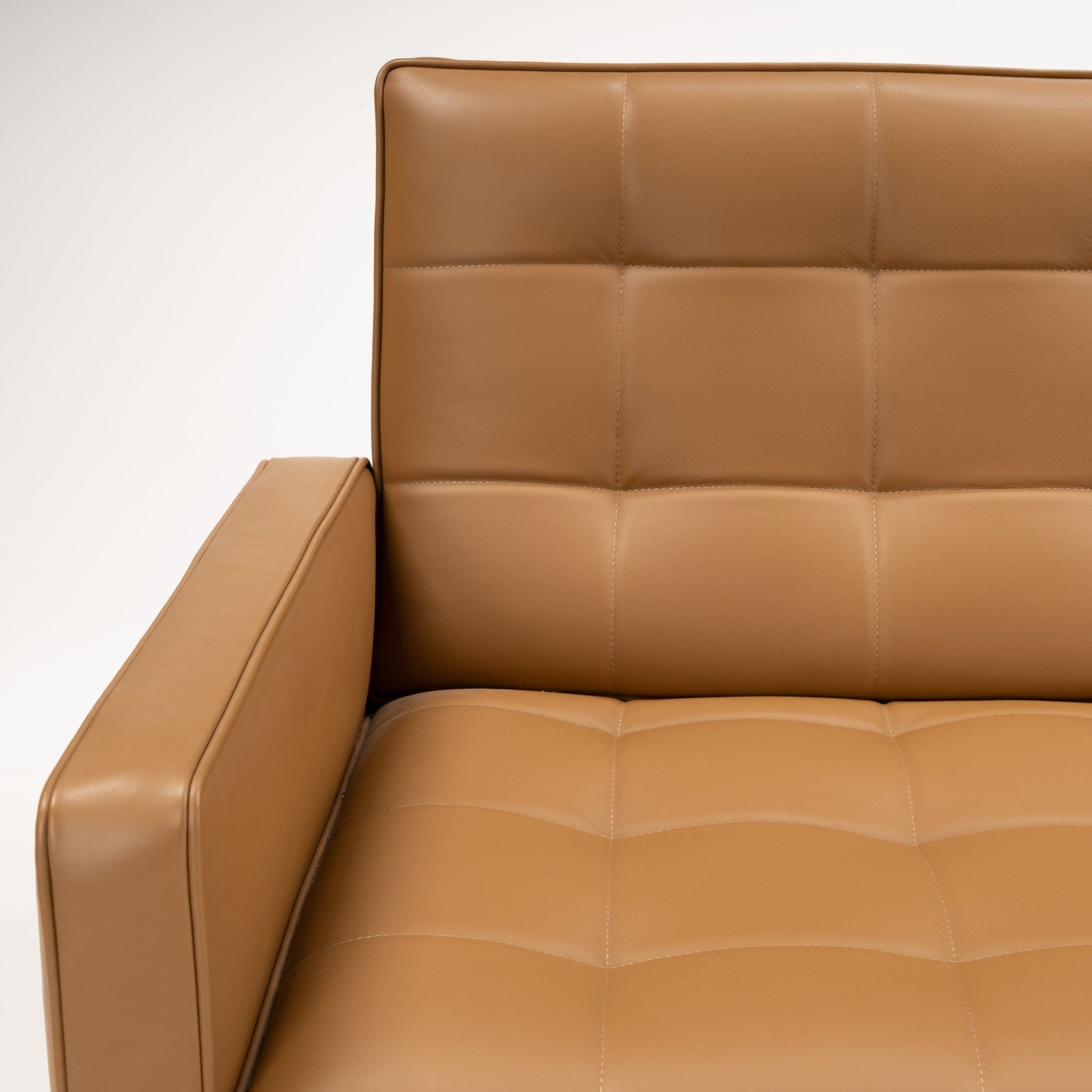 Florence Knoll 'Relaxed' Settee in Leather showing caramel brown stitched cushions and a structured arm in mid century modern furniture style