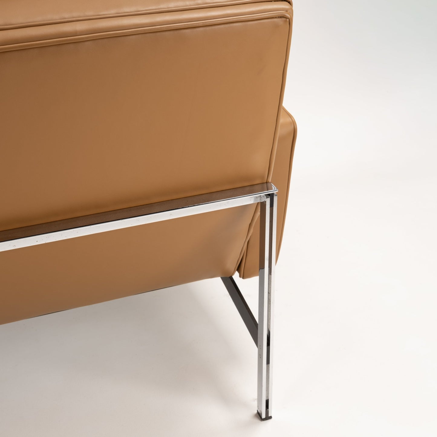 Florence Knoll 'Relaxed' Settee in Leather rear view with caramel brown upholstery polished chrome frame and slim legs in mid century modern furniture style