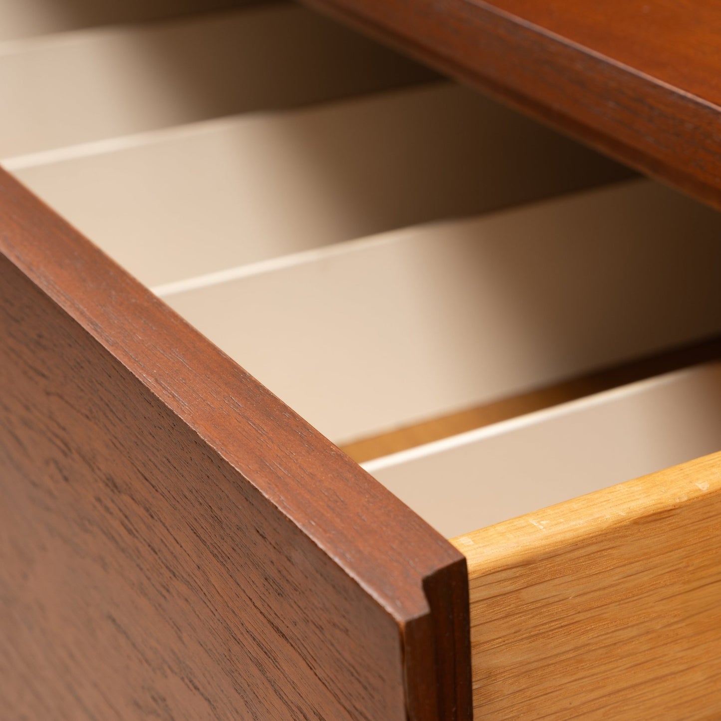 Florence Knoll Walnut Chest of Drawers open drawer detail showing warm walnut grain clean lines and spacious cream interiors in mid century modern furniture style