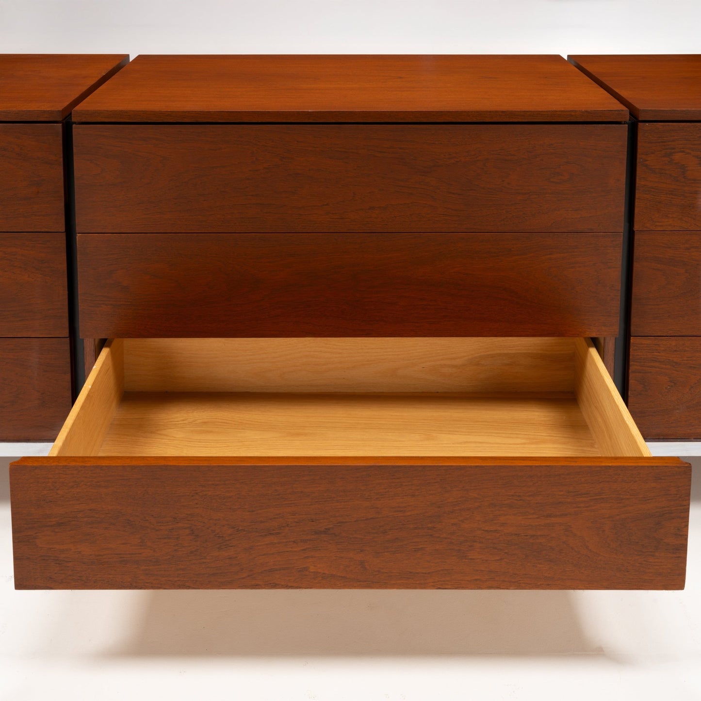 Florence Knoll Walnut Chest of Drawers with an open drawer revealing a light wood interior and rich walnut grain in mid century modern furniture style