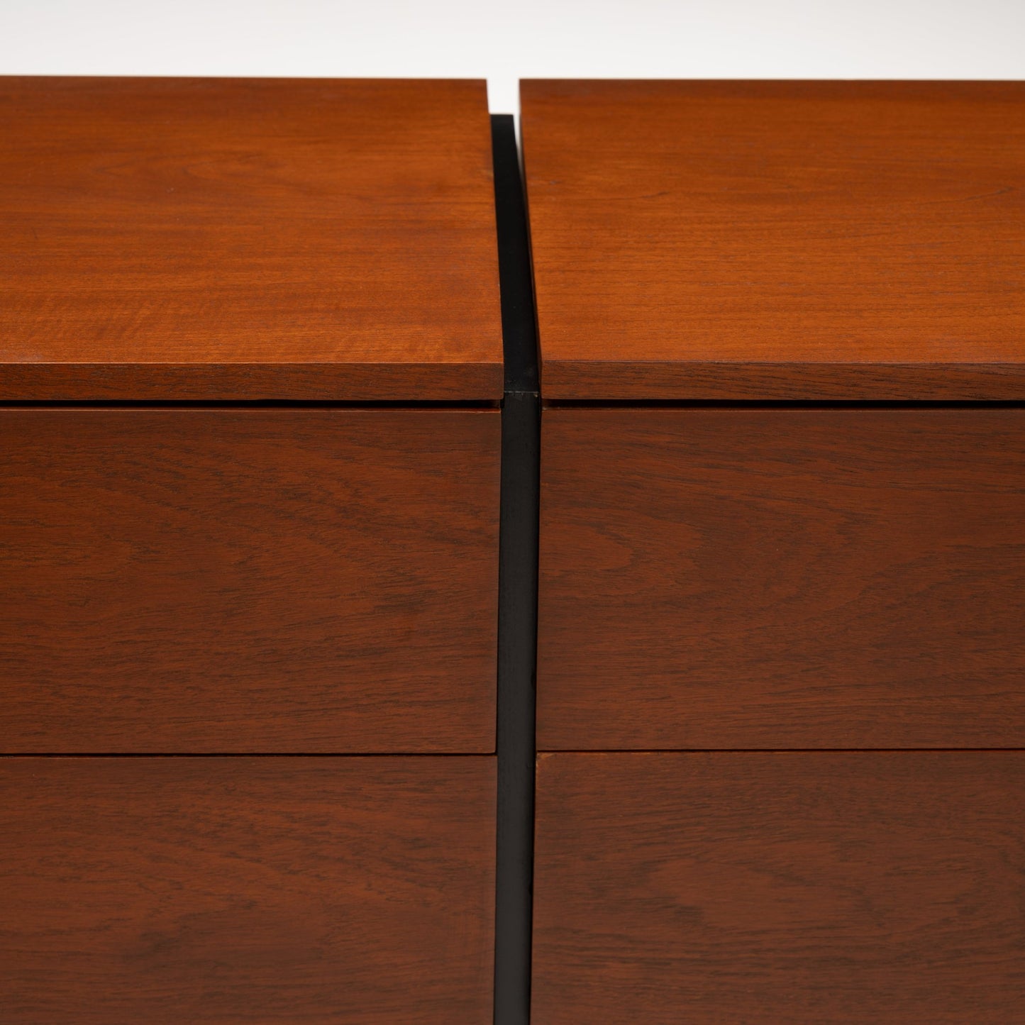 Florence Knoll Walnut Chest of Drawers close detail showing rich walnut grain aligned drawer fronts and contrasting black central divider in mid century modern furniture style