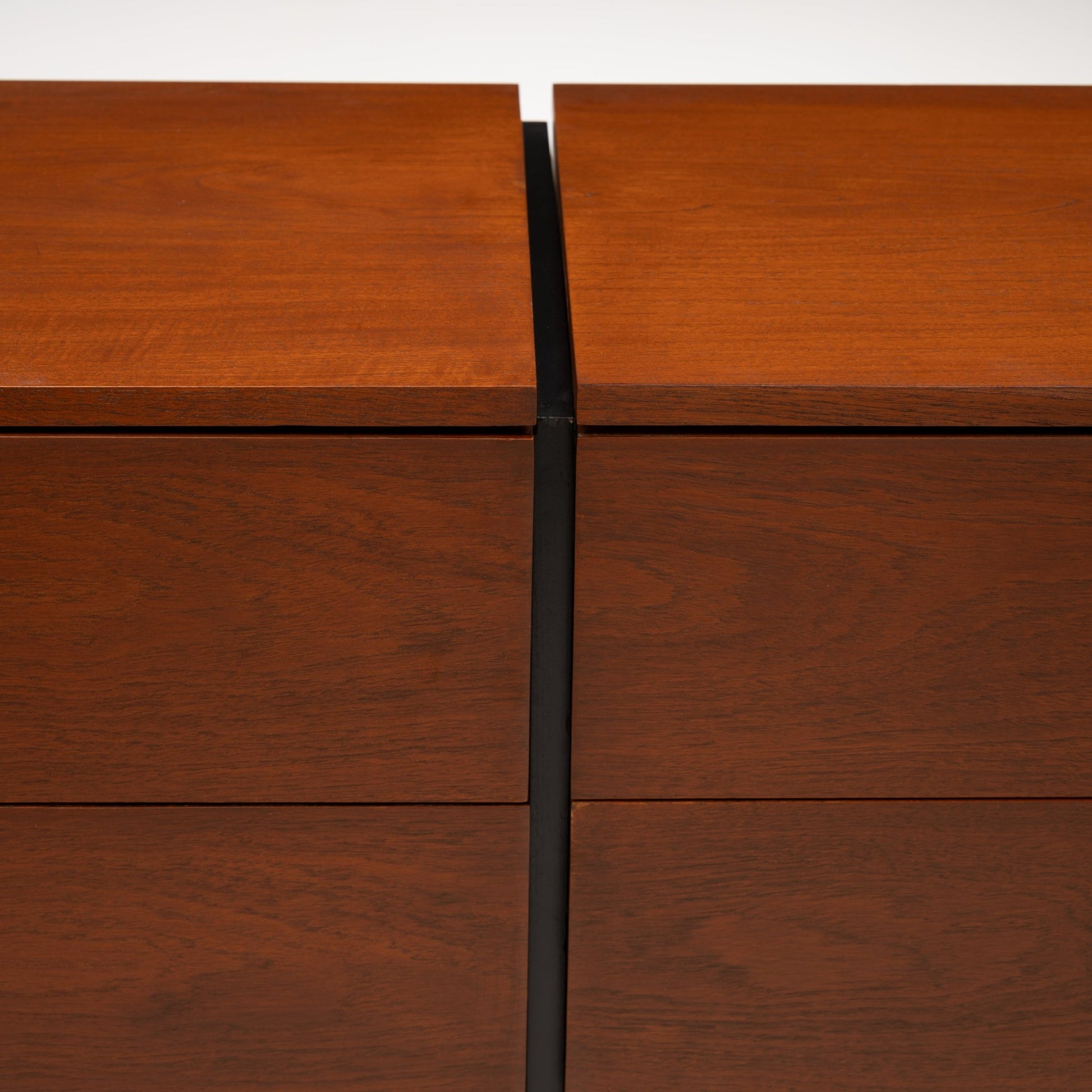 Florence Knoll Walnut Chest of Drawers close detail showing rich walnut grain aligned drawer fronts and contrasting black central divider in mid century modern furniture style
