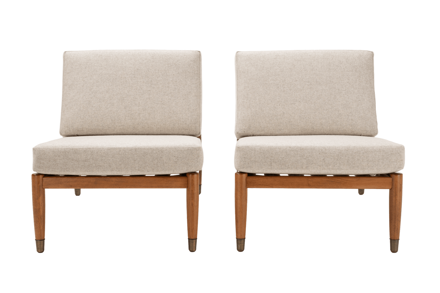 Pair of Folke Ohlsson armless slipper lounge chairs with beige upholstery and beechwood frames on white background
