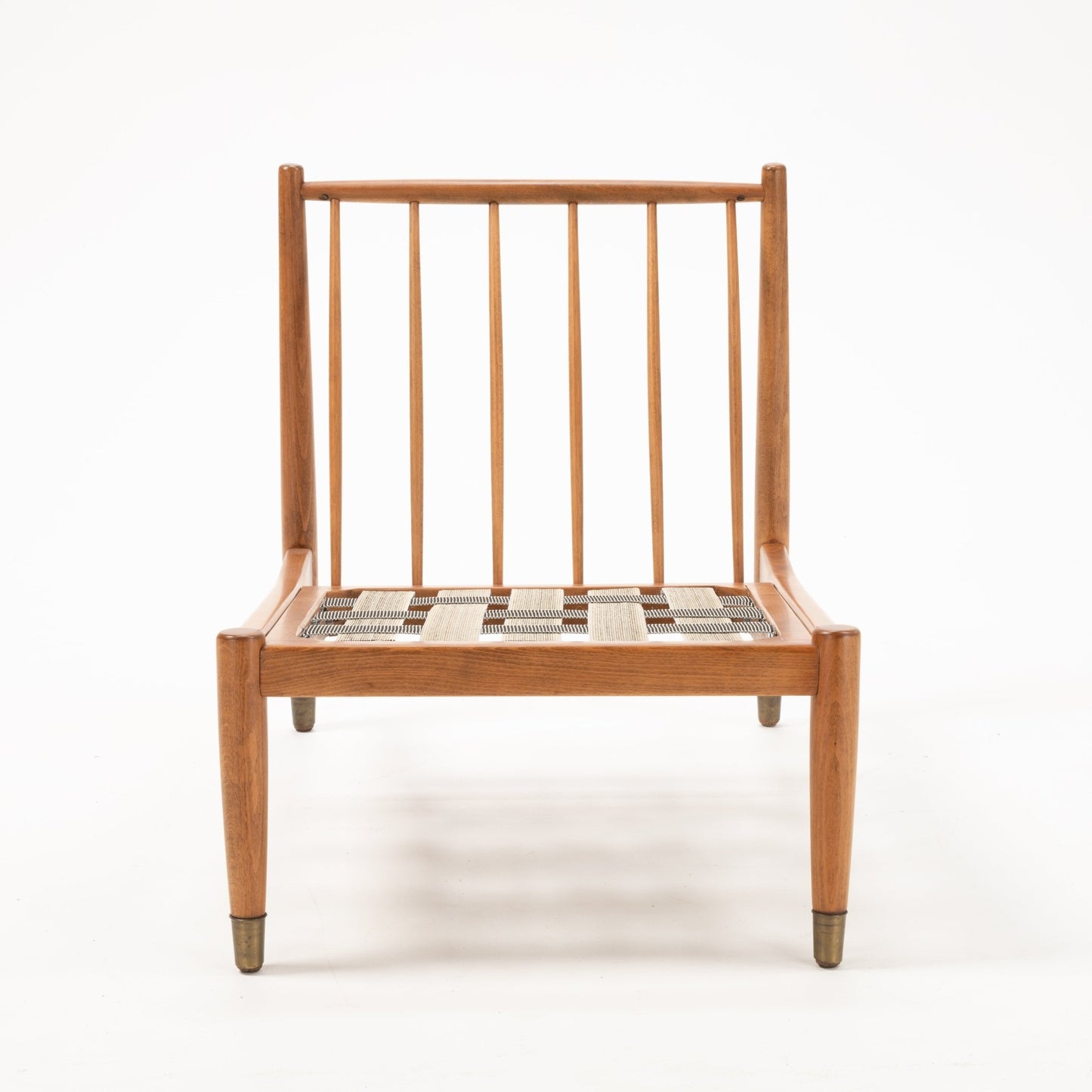 Front view of Folke Ohlsson slipper lounge chair frame showing vertical slats and woven seat support