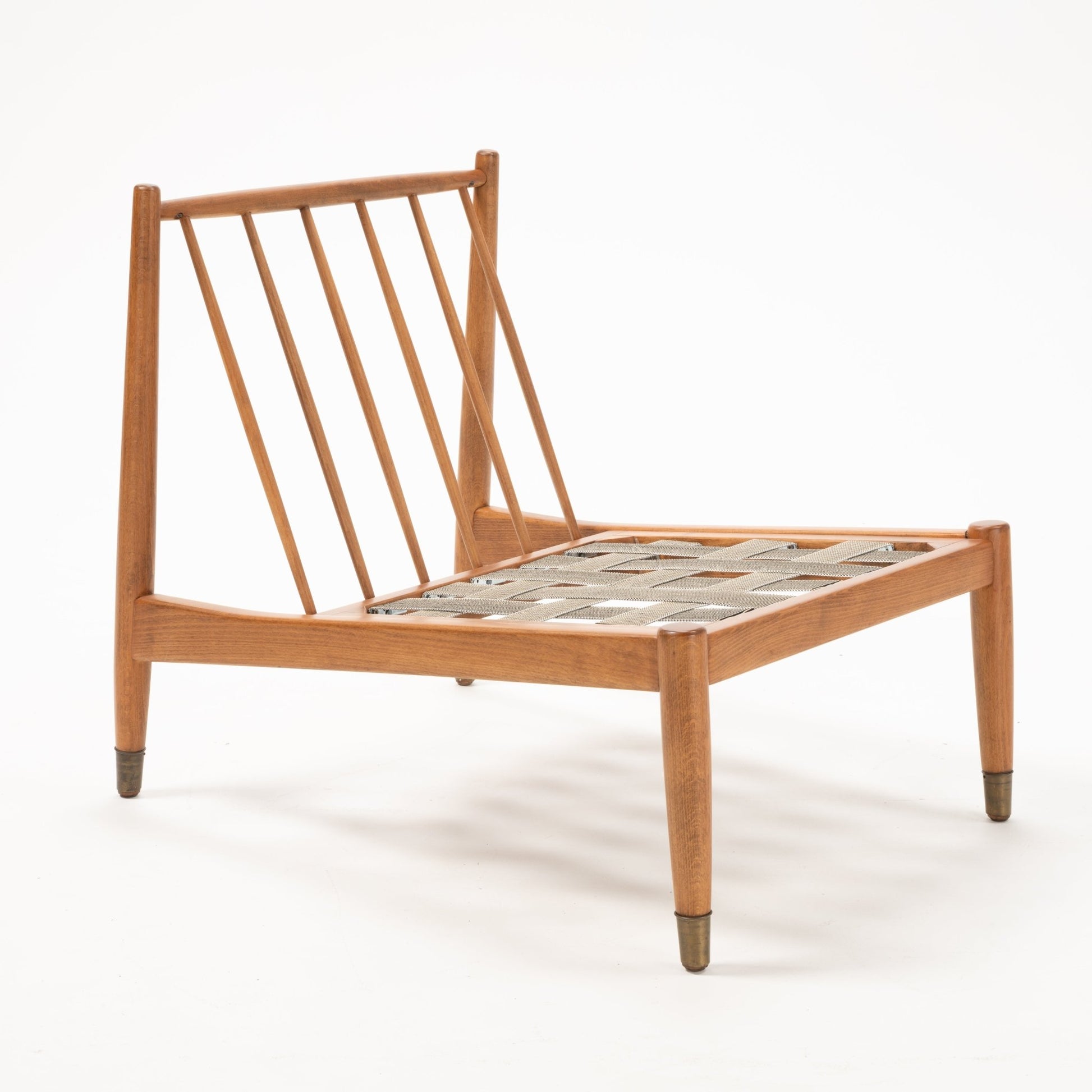 Mid-century Folke Ohlsson slipper lounge chair frame showing angled beechwood slats and metal-tipped legs without cushions