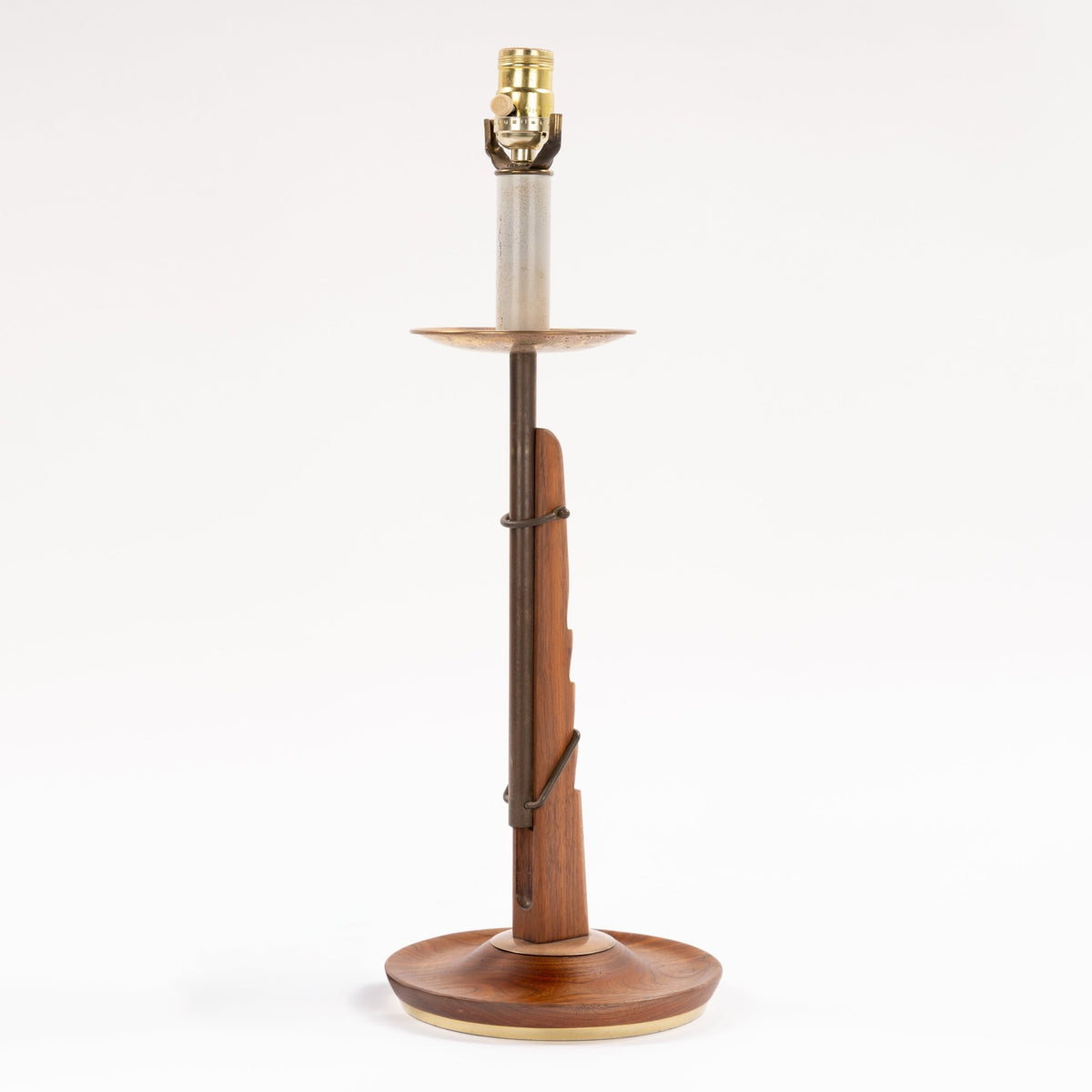 Francis Elkins Attributed Ratchet Table Lamp with a sculptural walnut column brass tray exposed socket and round wood base in mid century modern lighting