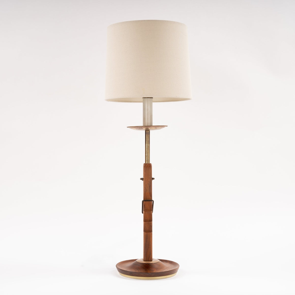 Francis Elkins Attributed Ratchet Table Lamp with a wood and brass column cream drum shade and round wood base in mid century modern lighting