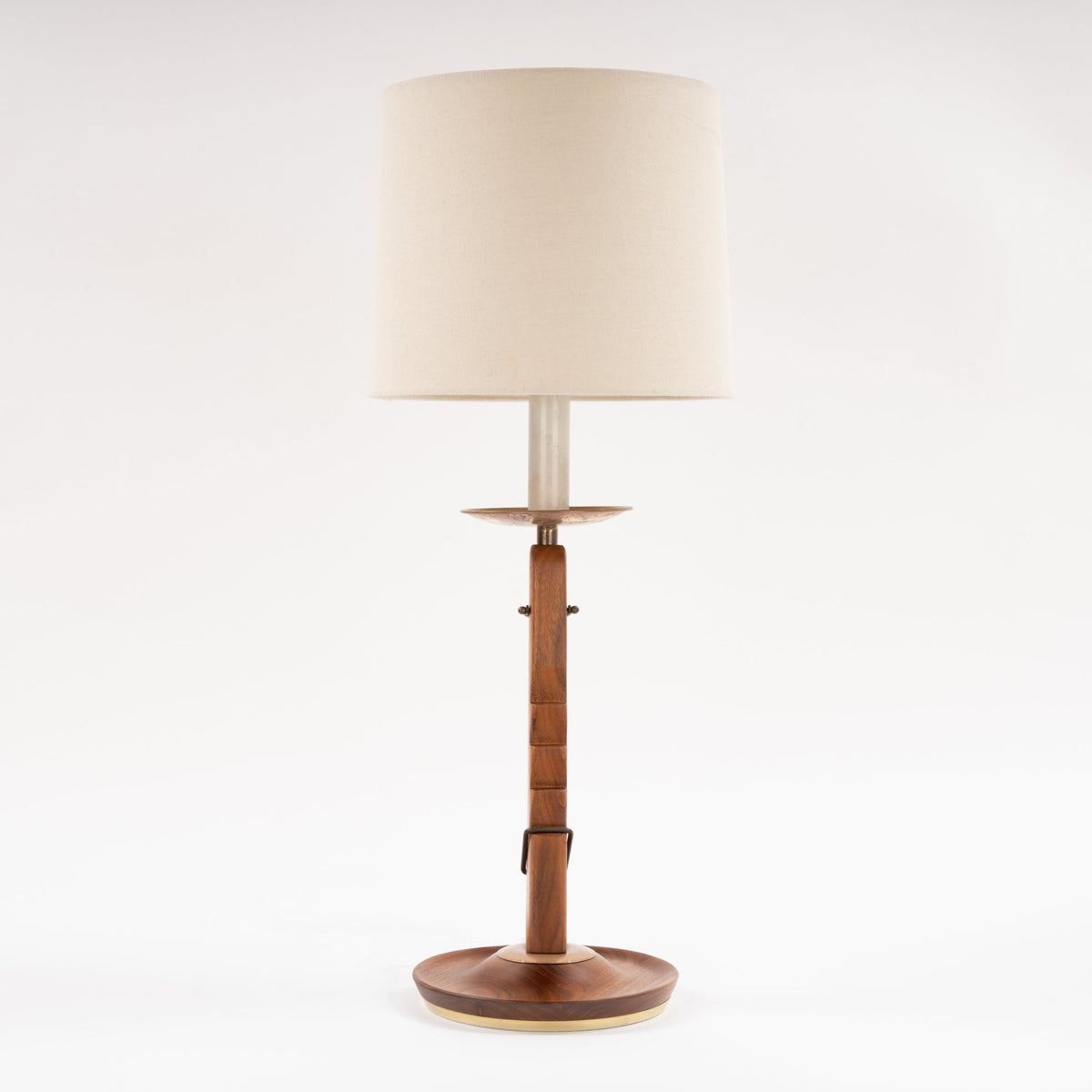 Francis Elkins Attributed Ratchet Table Lamp with a wood column brass details cream drum shade and round wood base in mid century modern lighting