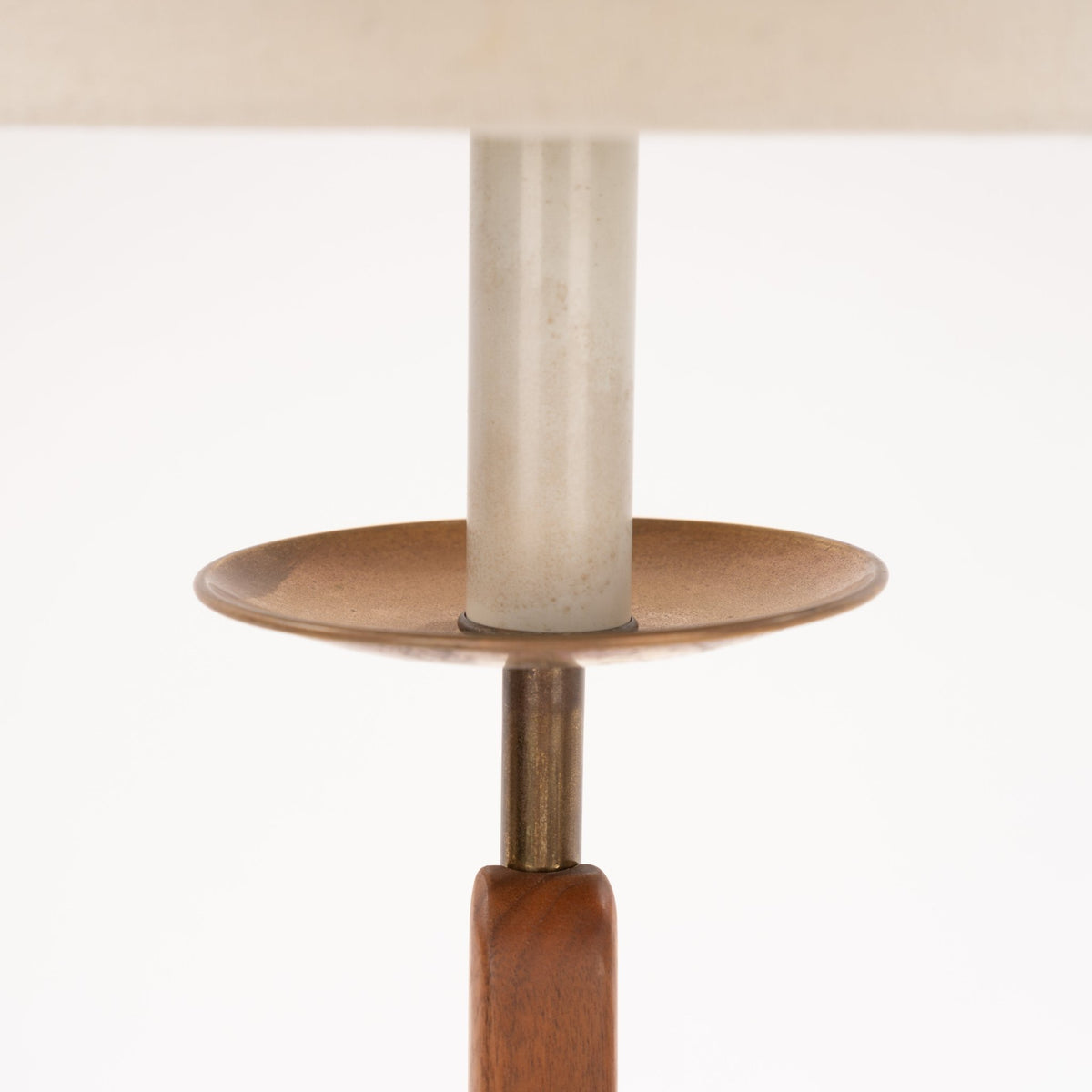 Francis Elkins Attributed Ratchet Table Lamp close up of its cream column brass tray and warm wood stem in mid century modern lighting