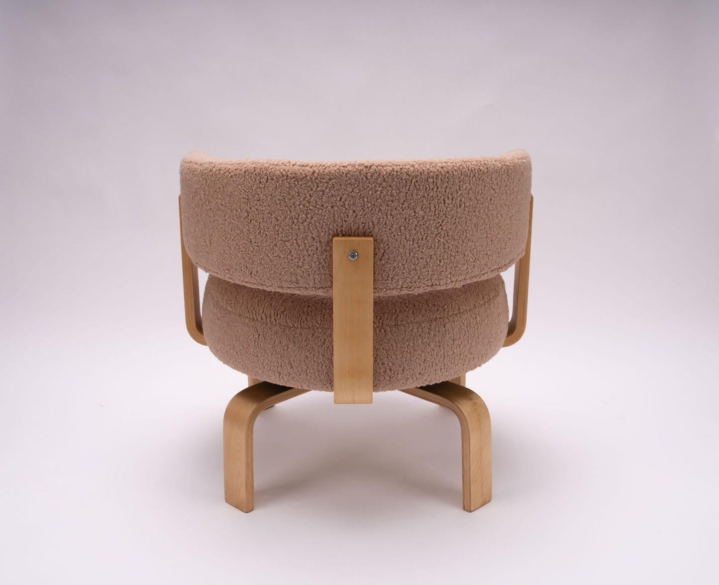 Mid-century modern Fridene swivel armchair with Maharam faux sheepskin upholstery and beechwood frame, viewed from back