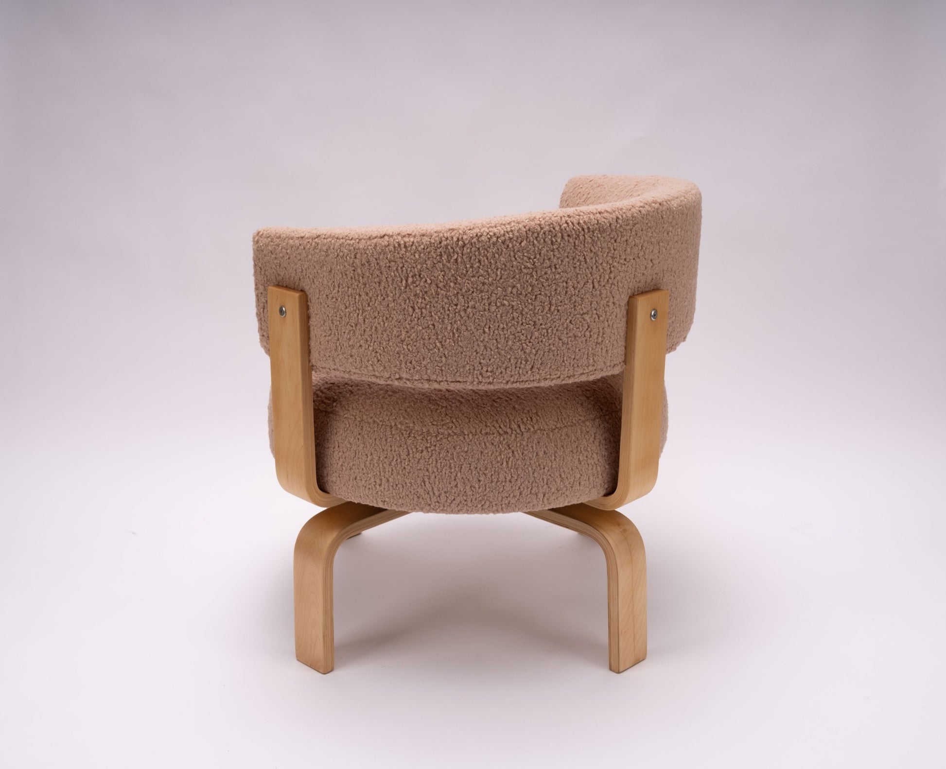 Pair of 2000s Fridene swivel armchairs by Carina Bengs with maharam faux sheepskin upholstery and beechwood frames.