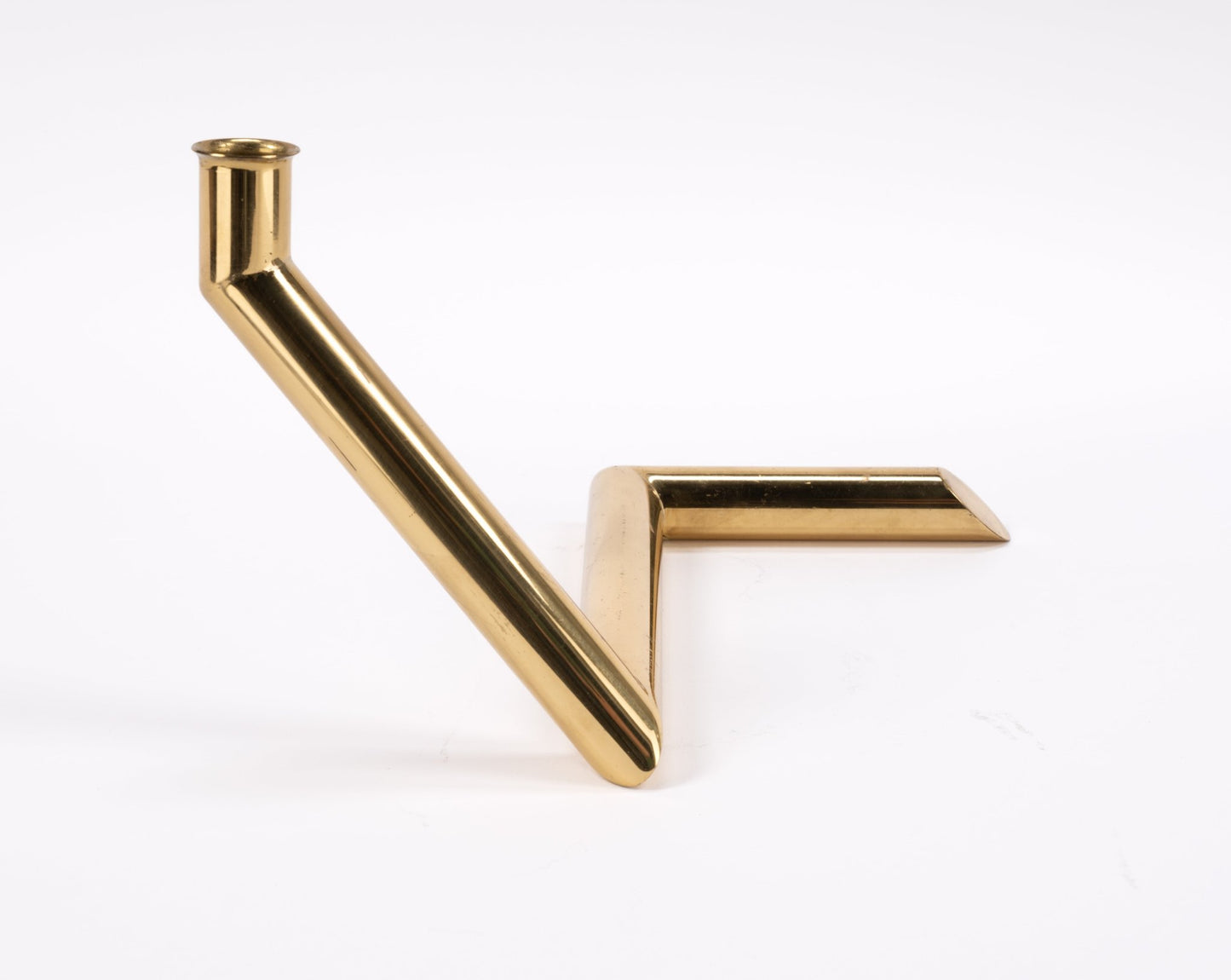 1970s Danish Go Products brass candle holder with polished finish and angular zigzag tubular design on white background
