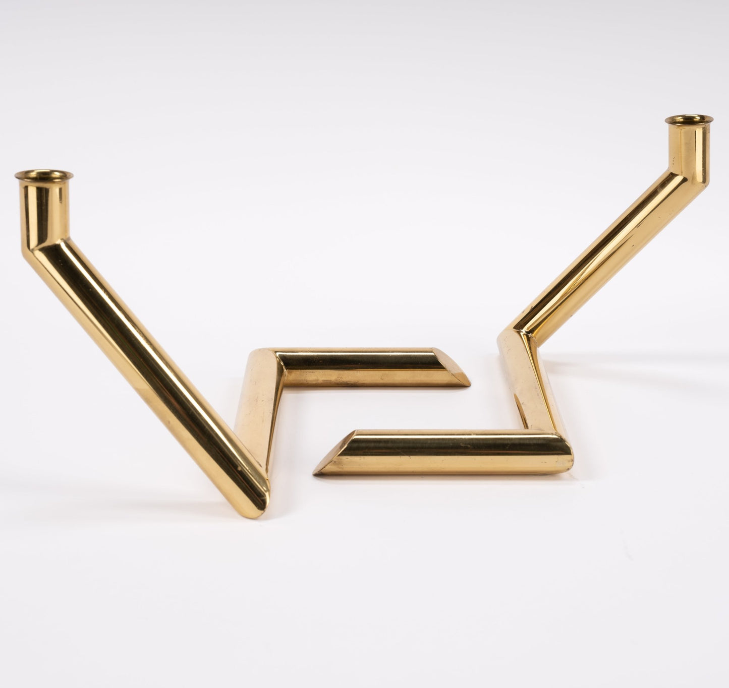 Pair of 1970s Danish Go Products brass candle holders with polished finish and angular zigzag tubular design