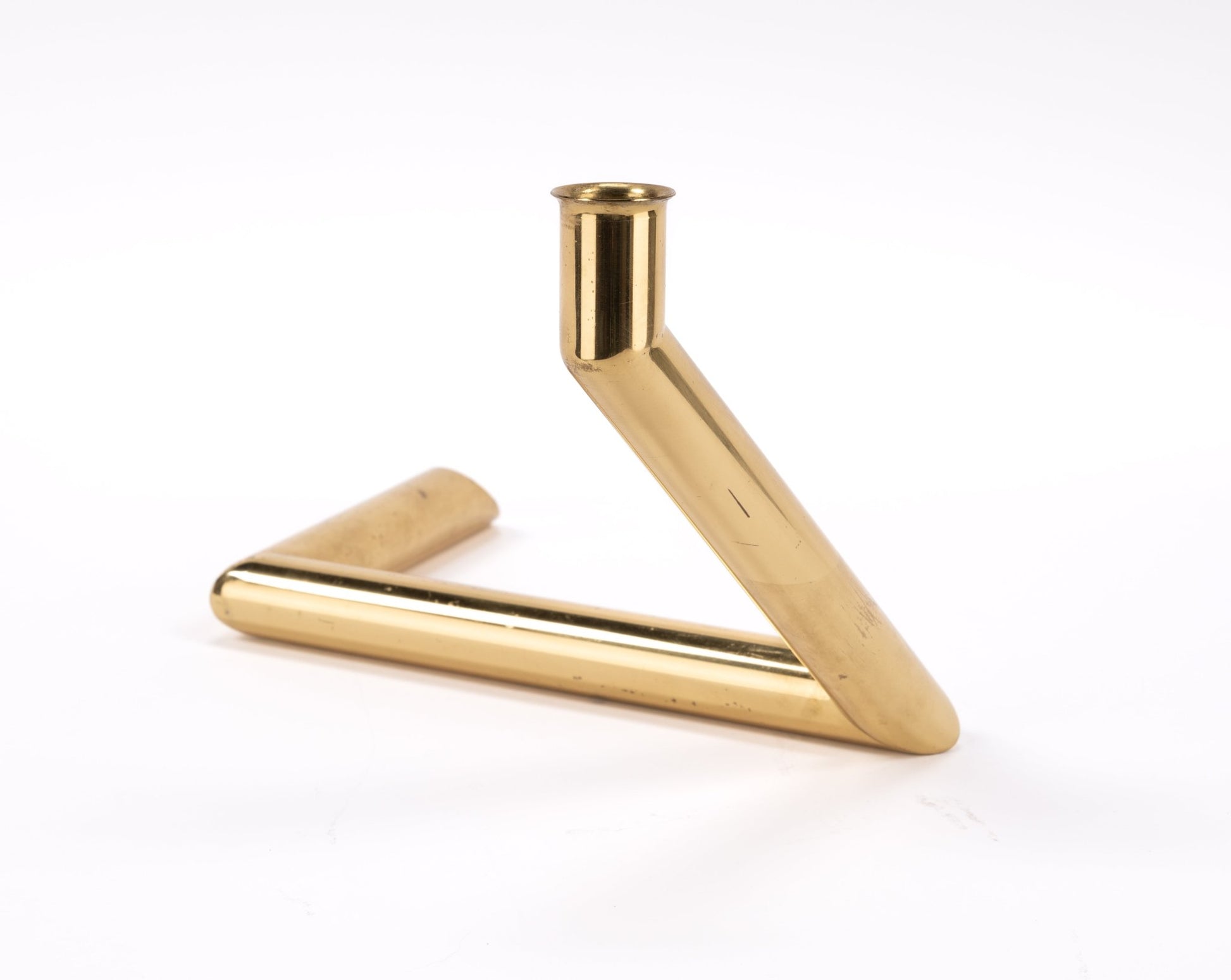 1970s Danish Go Products brass candle holder with polished finish and angular zigzag tubular form on white background