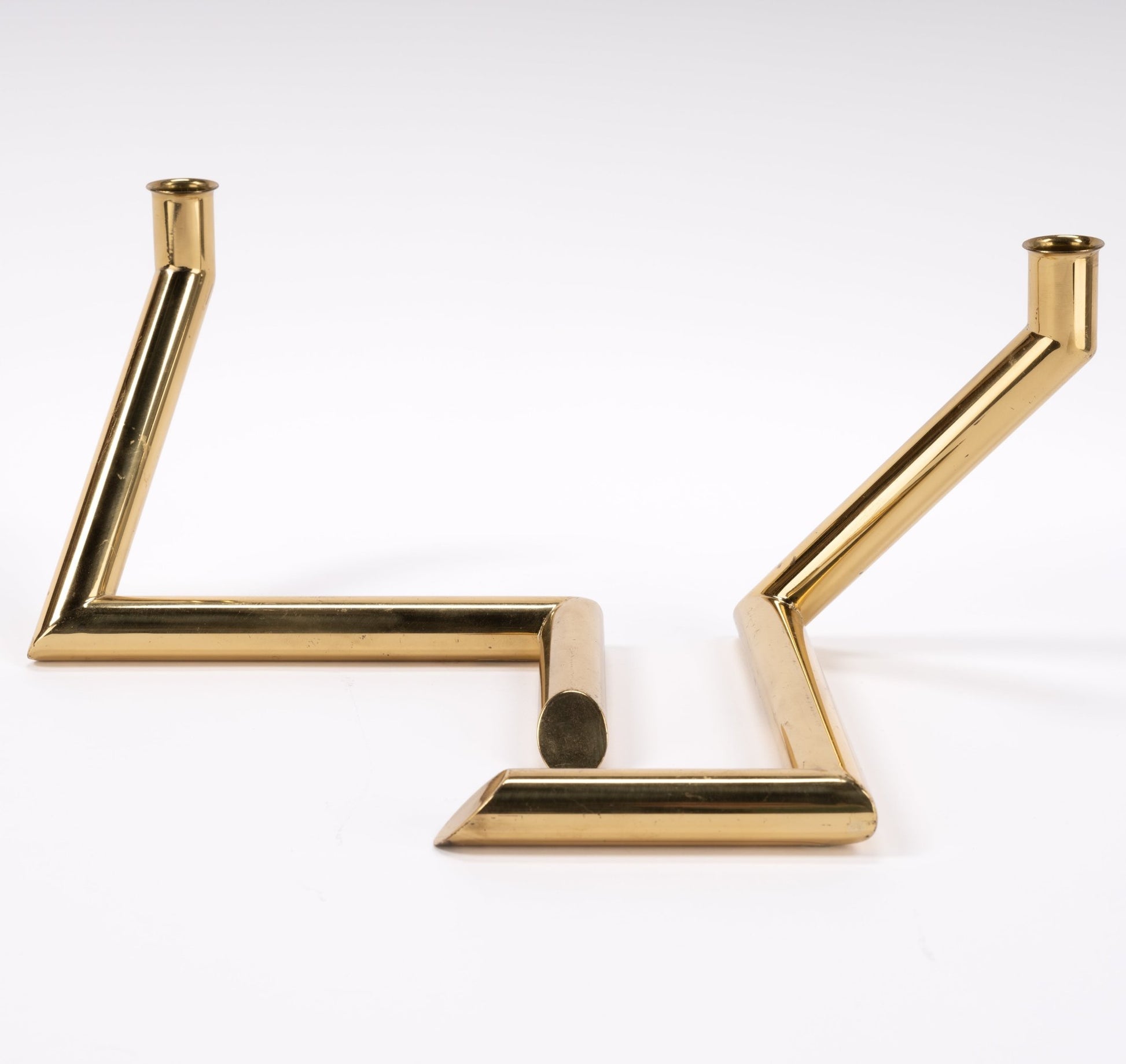 Pair of 1970s Danish Go Products brass candle holders with polished finish and angular zigzag tubular design