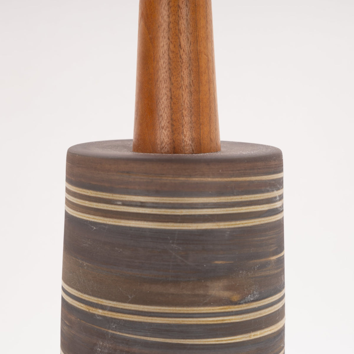 Gordon & Jane Martz Table Lamp close-up showing a dark striped ceramic base and warm wood stem in mid century modern lighting style