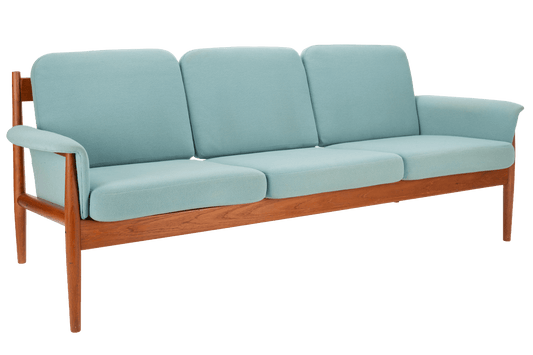 Grete Jalk Model 118 Teak Sofa featuring a sleek teak frame with gently curved armrests and light blue upholstered cushions, exemplifying classic mid century modern seating design.