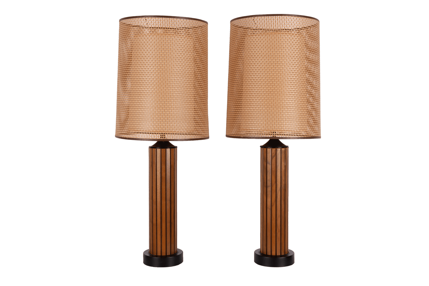 Pair of vintage 1960s walnut fluted wood table lamps with cane shades and center diffusers, featuring black accents.