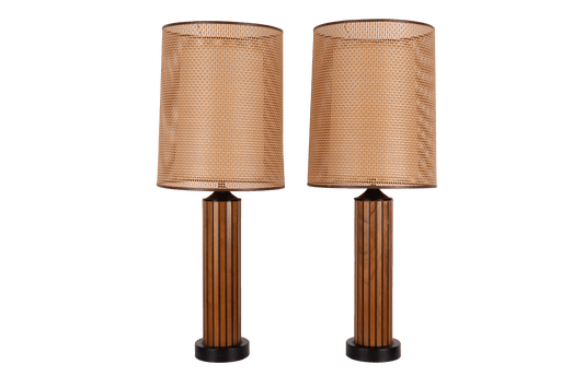 Pair of vintage 1960s walnut fluted wood table lamps with cane shades and center diffusers, featuring black accents.