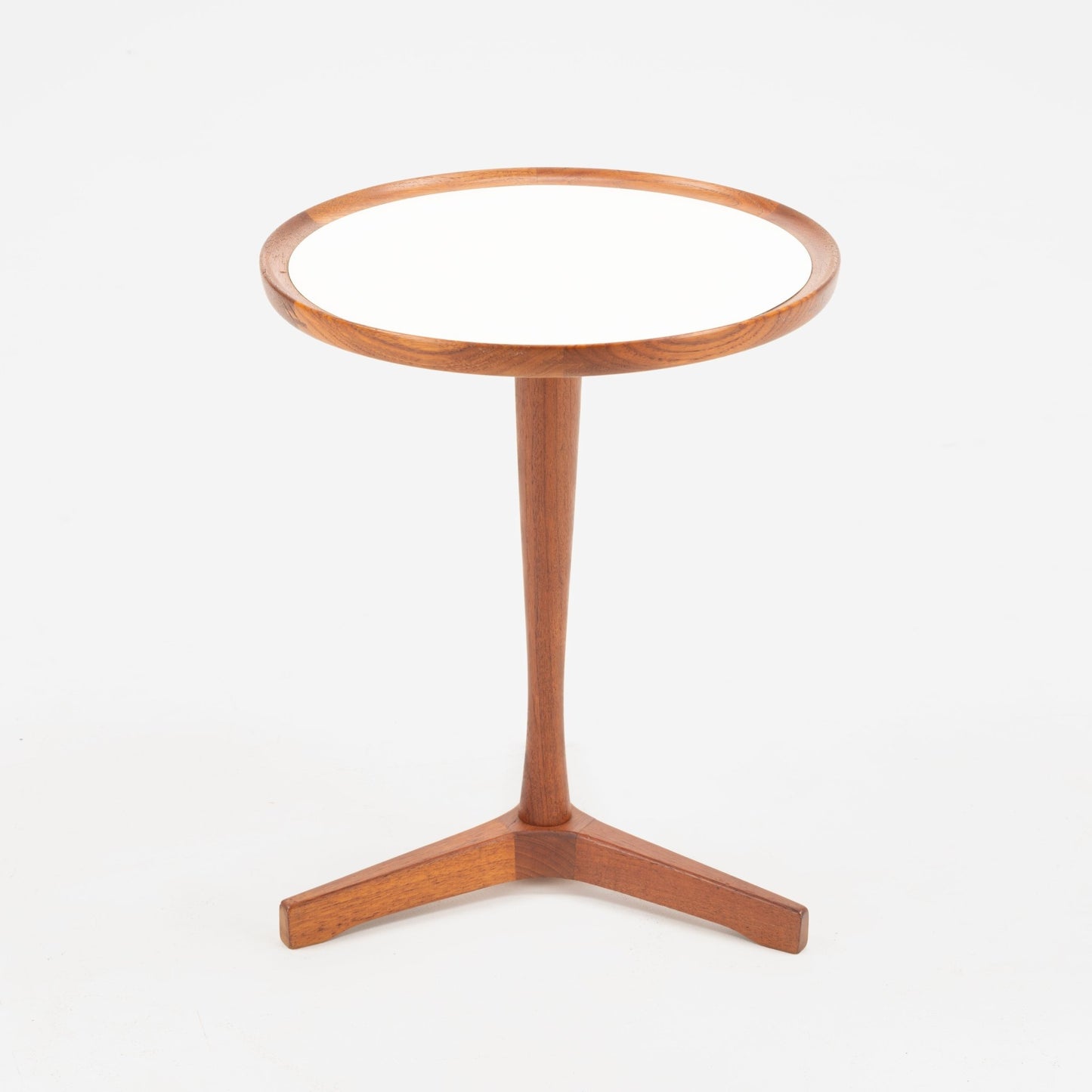 Hans Andersen Teak Tripod Side Table featuring a round white surface framed by warm teak wood, supported by a slender central leg extending to a tripod base, embodying mid century modern style.