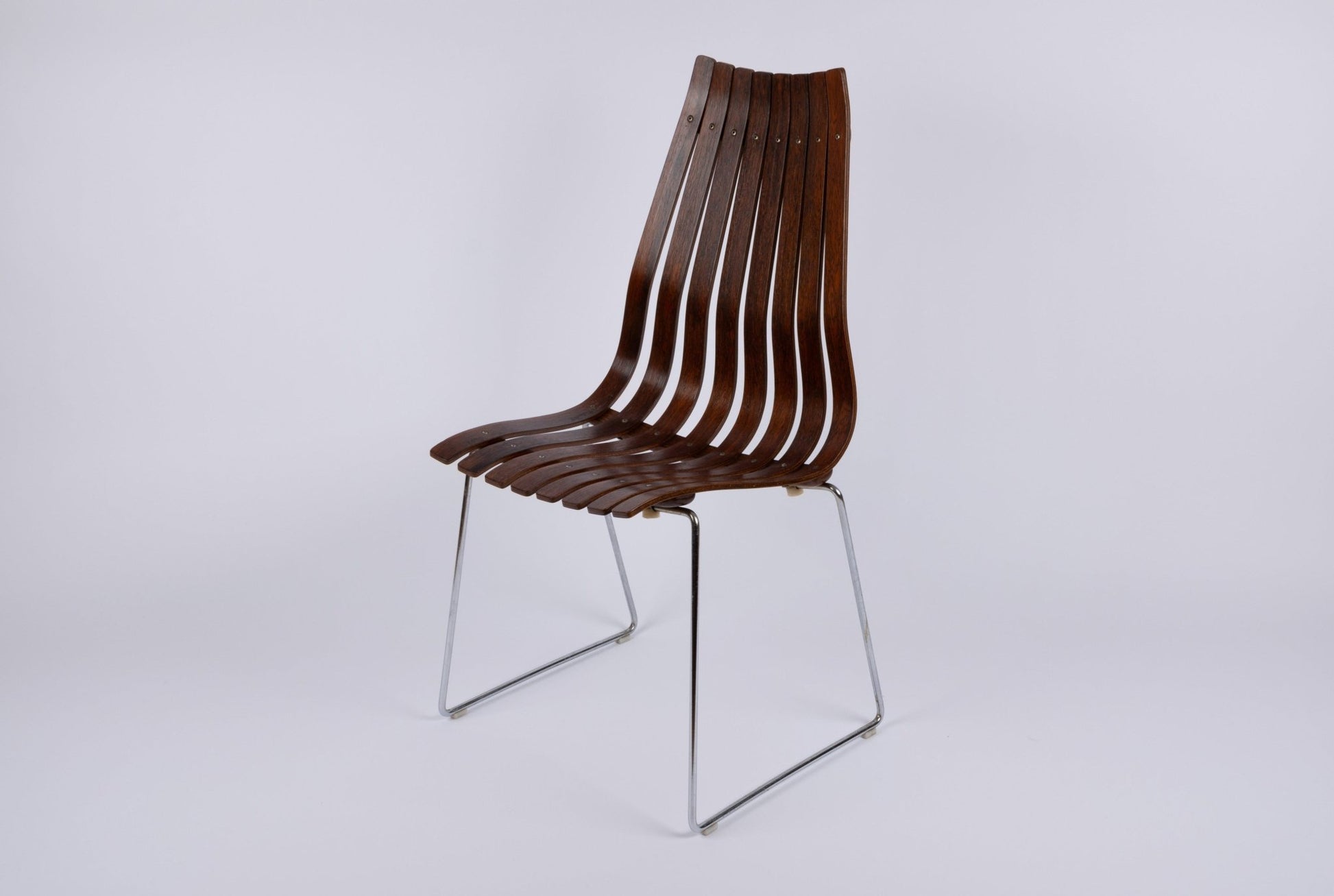 1960s Hans Brattrud Mobler dining chair with curved laminated rosewood slats and chrome frame from Norway