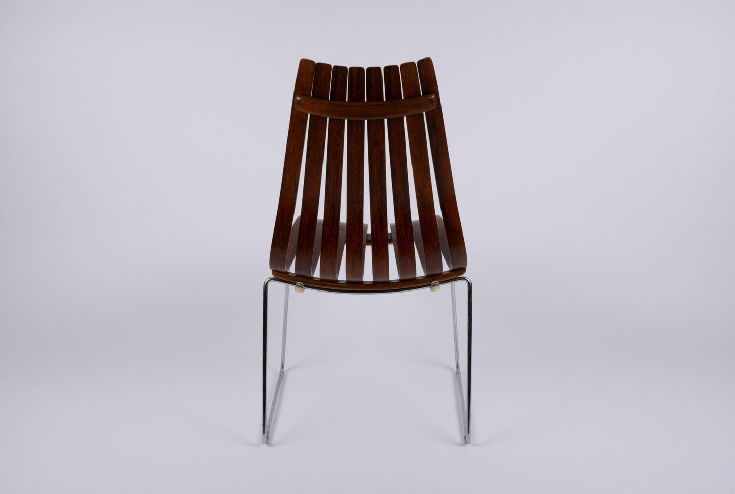 Hans Brattrud Mobler dining chair with curved rosewood slats and chrome frame, designed in Norway during the 1960s