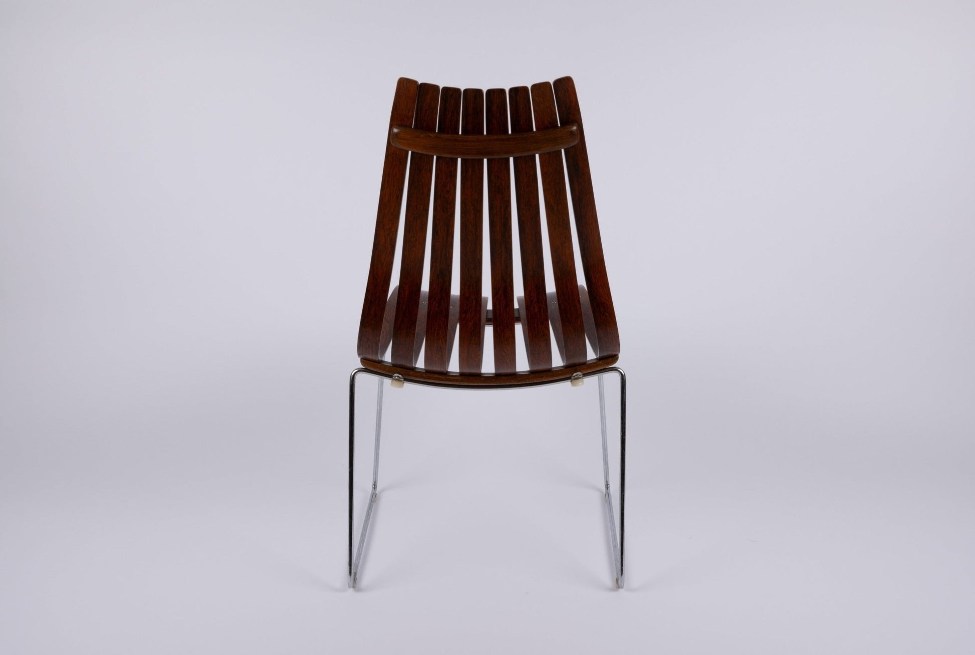 Hans Brattrud Mobler dining chair with curved rosewood slats and chrome frame, designed in Norway during the 1960s
