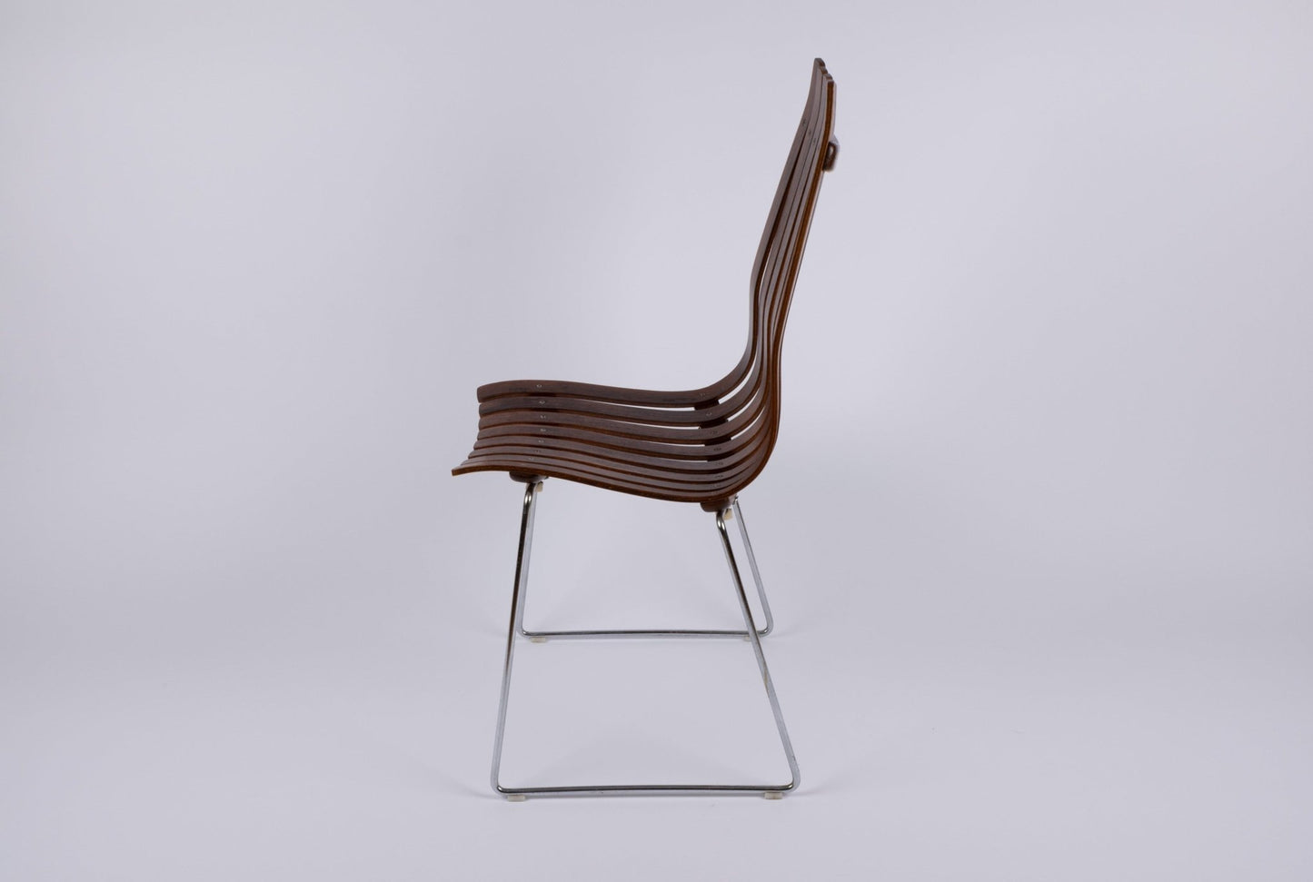 Hans Brattrud Mobler dining chair with curved laminated rosewood slats and chrome frame, 1960s Norway design.