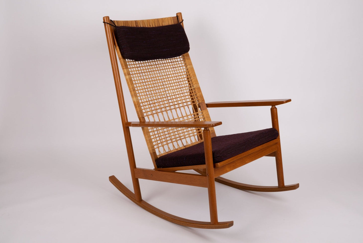 Hans Olsen 1960s Danish teak wood cane rocking chair with new upholstery and minimalist design by Juul Kristensen