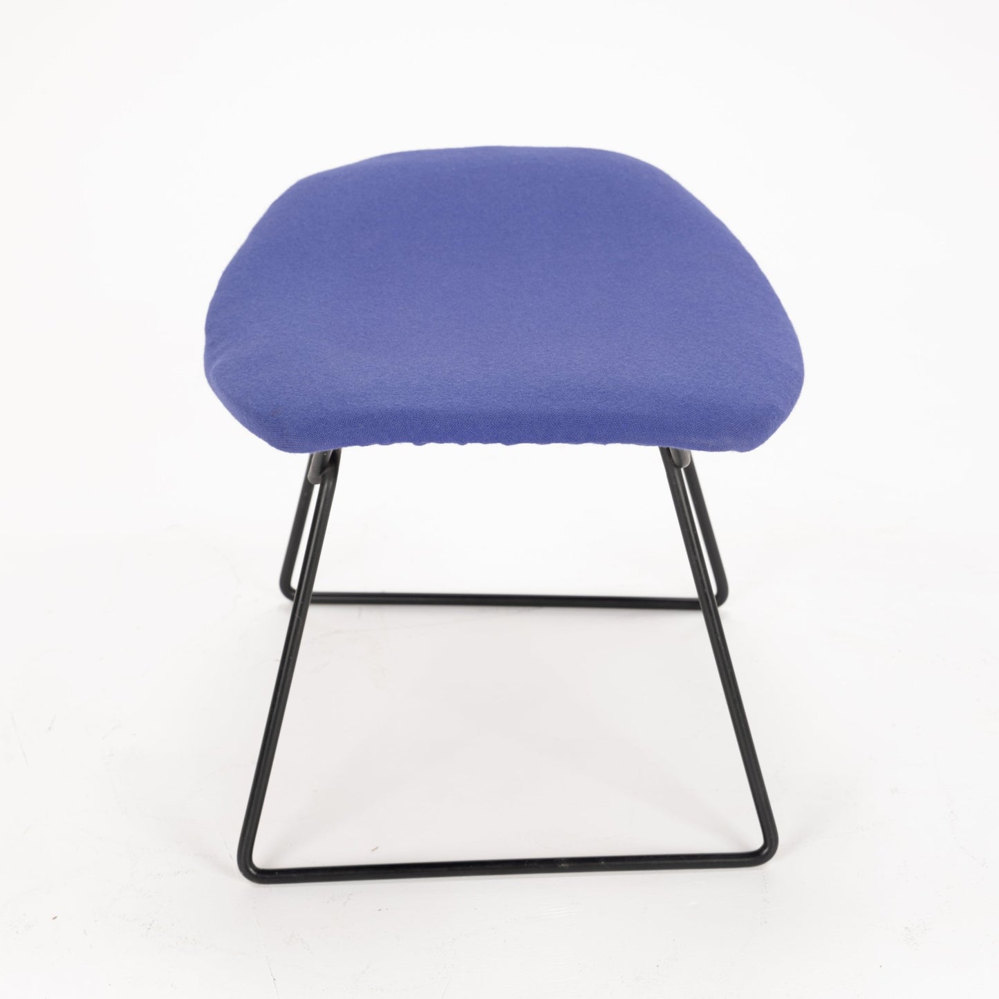 Front view of a stool with a curved blue fabric cushion and minimalist black metal frame base