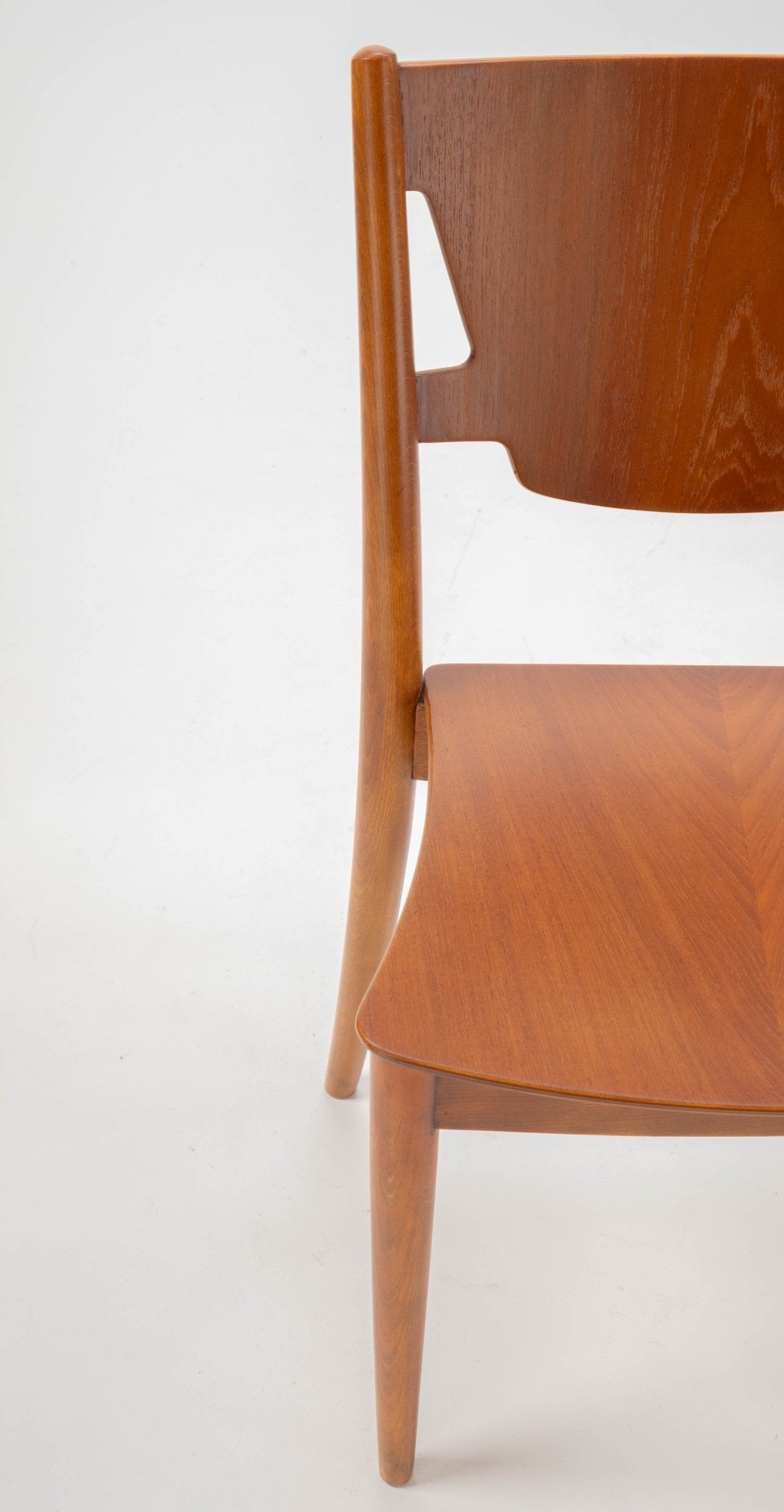Mid-century modern Hvidt & Molgaard teak and beech desk chair with curved backrest and tapered legs.