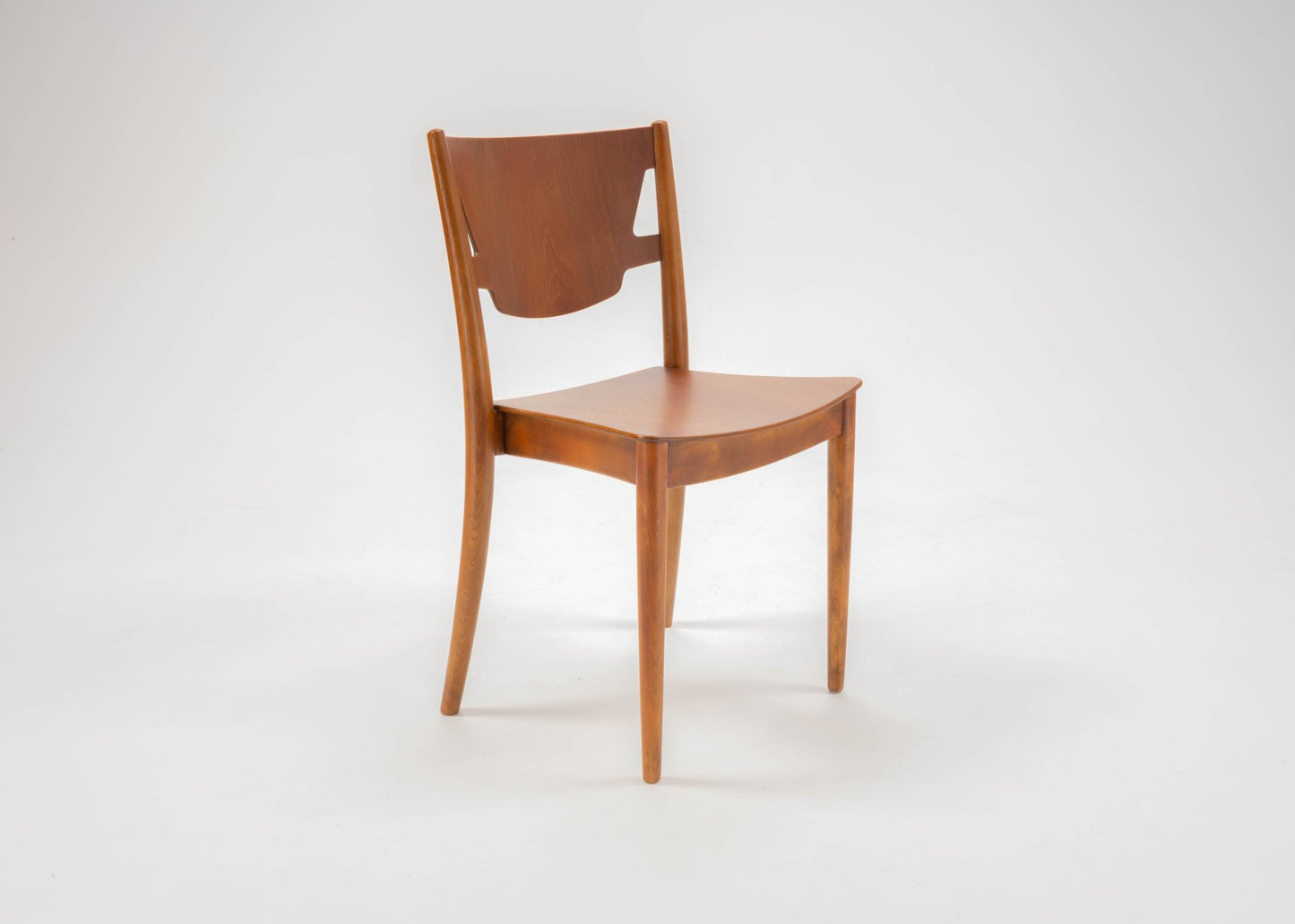 Mid-century modern desk chair by Hvidt & Molgaard with curved backrest and tapered legs in teak and beech wood.