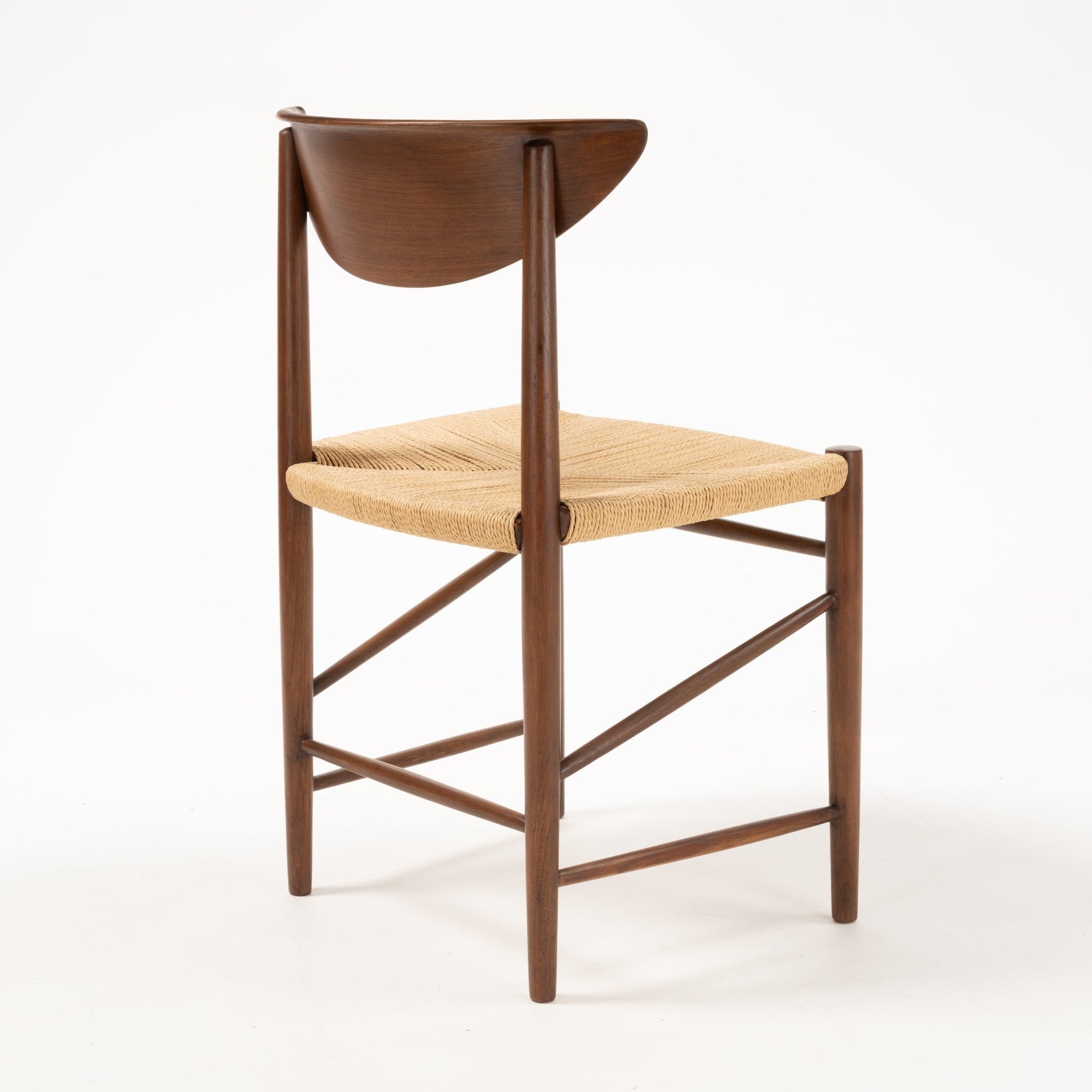Rear angle of Hvidt & Molgaard Model 316 chair highlighting sculpted teak backrest and woven natural fiber seat on slim frame