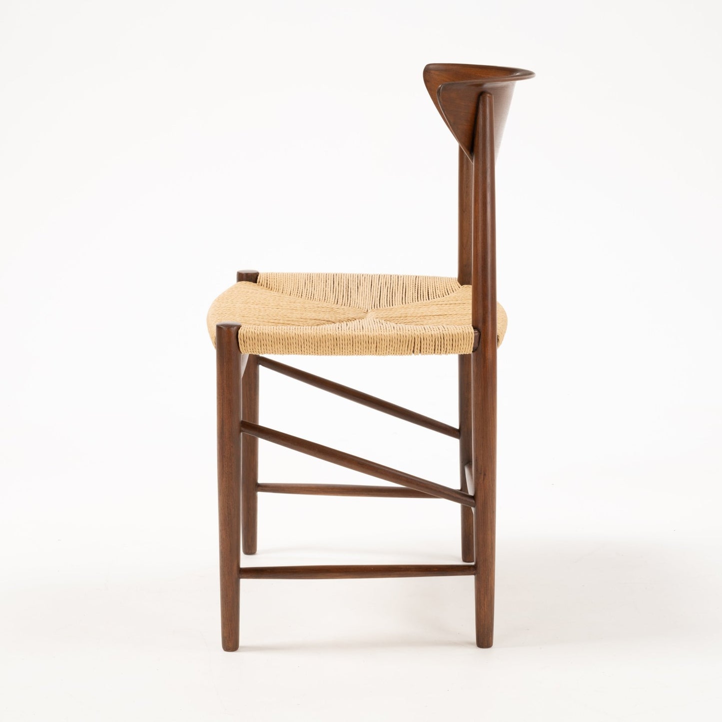 Profile of Hvidt & Molgaard Model 316 chair featuring sculpted teak backrest and woven natural fiber seat on tapered legs