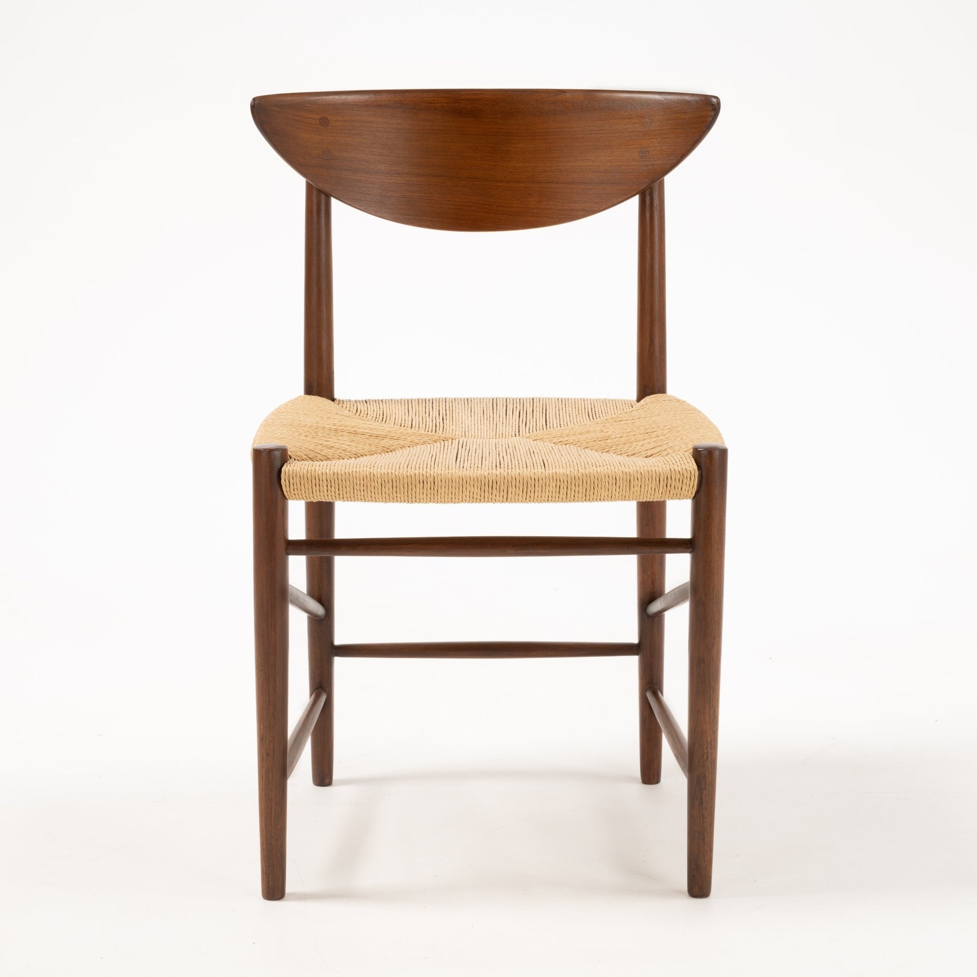 Front view of Hvidt & Molgaard Model 316 chair with sculpted crescent-shaped teak backrest and woven natural fiber seat