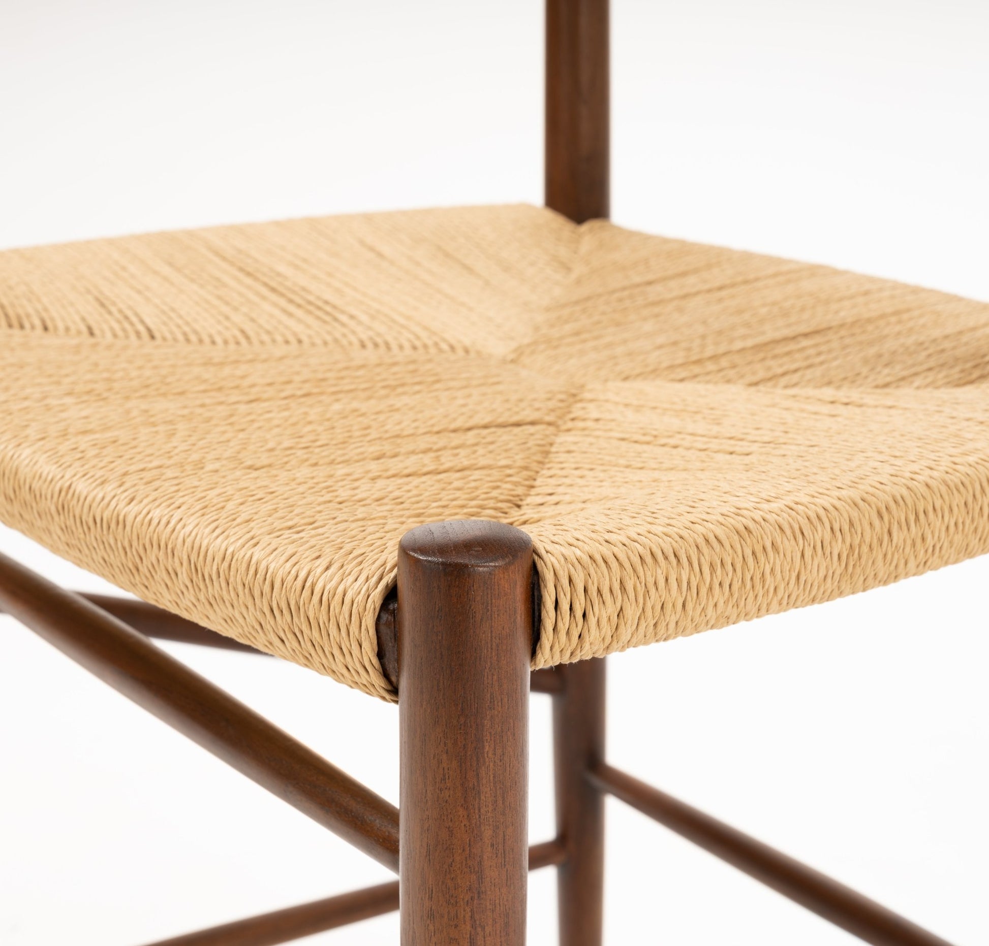 Close-up of woven natural fiber seat and rounded teak wood leg on the Hvidt & Molgaard Model 316 chair pair