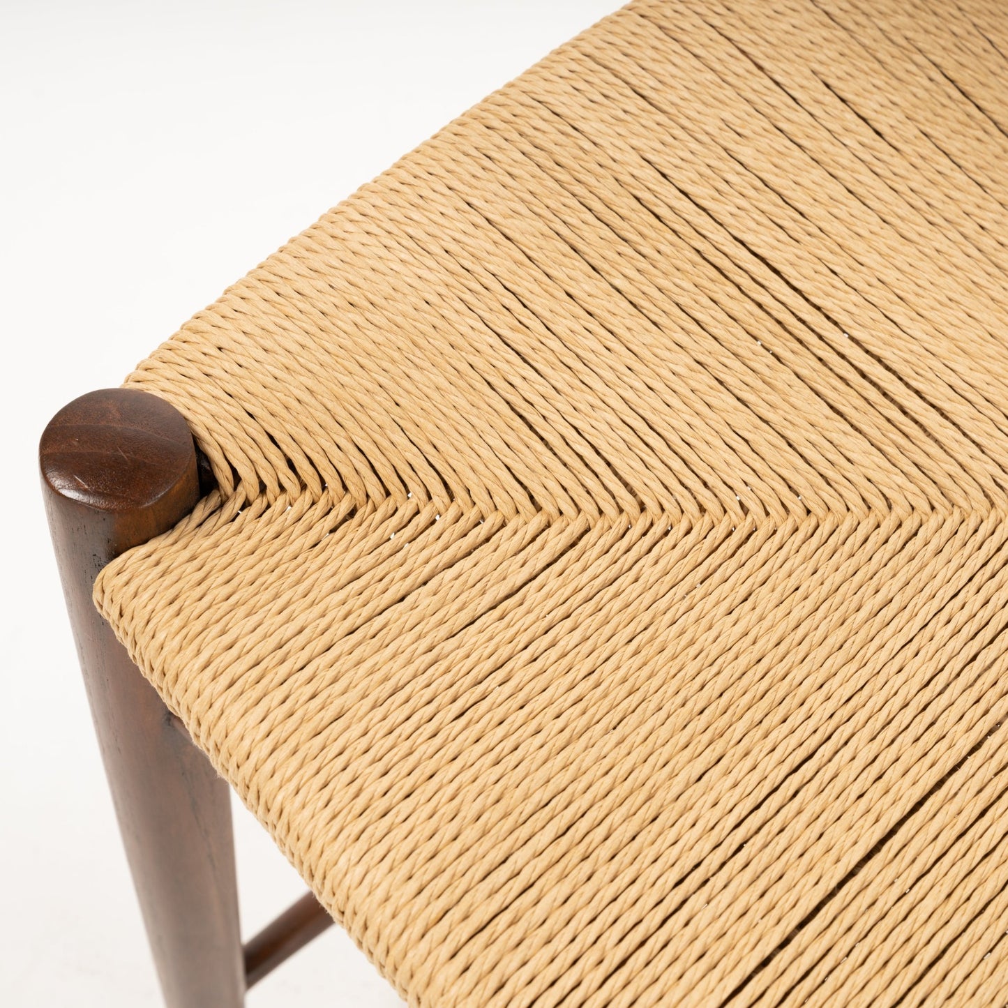 Close-up of handwoven natural fiber seat and dark teak wood corner post on Hvidt & Molgaard Model 316 chair