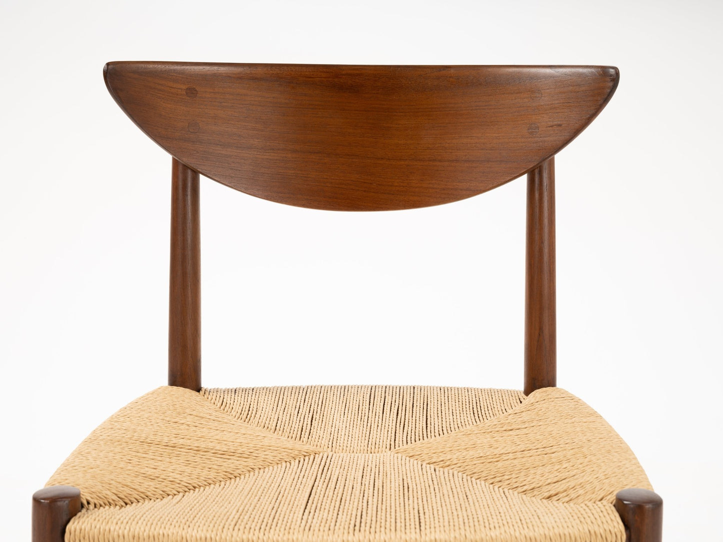 Close-up of sculpted crescent-shaped teak backrest and woven natural fiber seat on Hvidt & Molgaard Model 316 chair