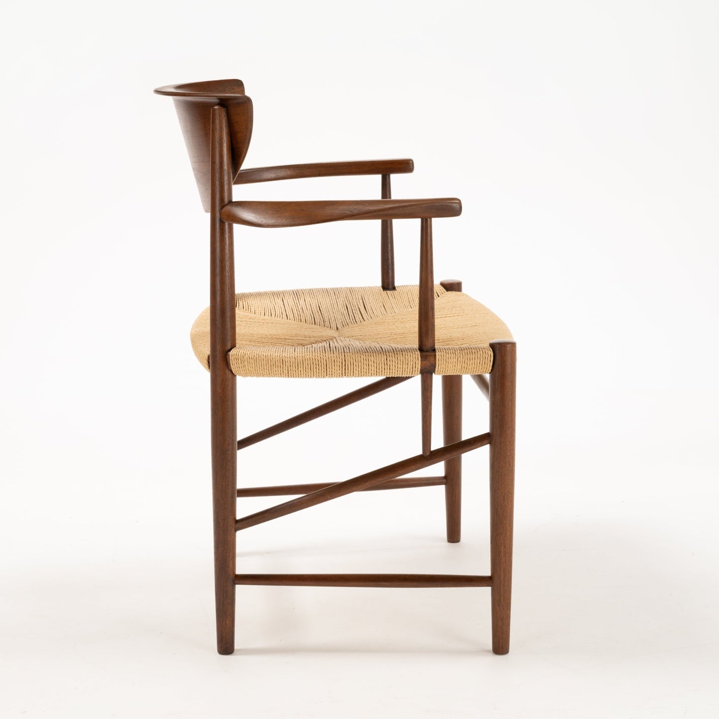 Side profile of Hvidt & Molgaard Model 317 chair with solid wood frame and woven seat in natural fiber