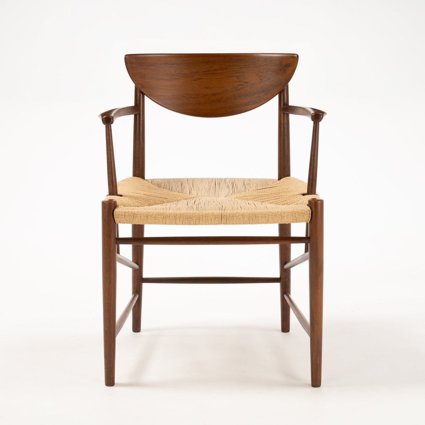 Front view of Hvidt & Molgaard Model 317 chair with crescent-shaped teak backrest and woven natural fiber seat